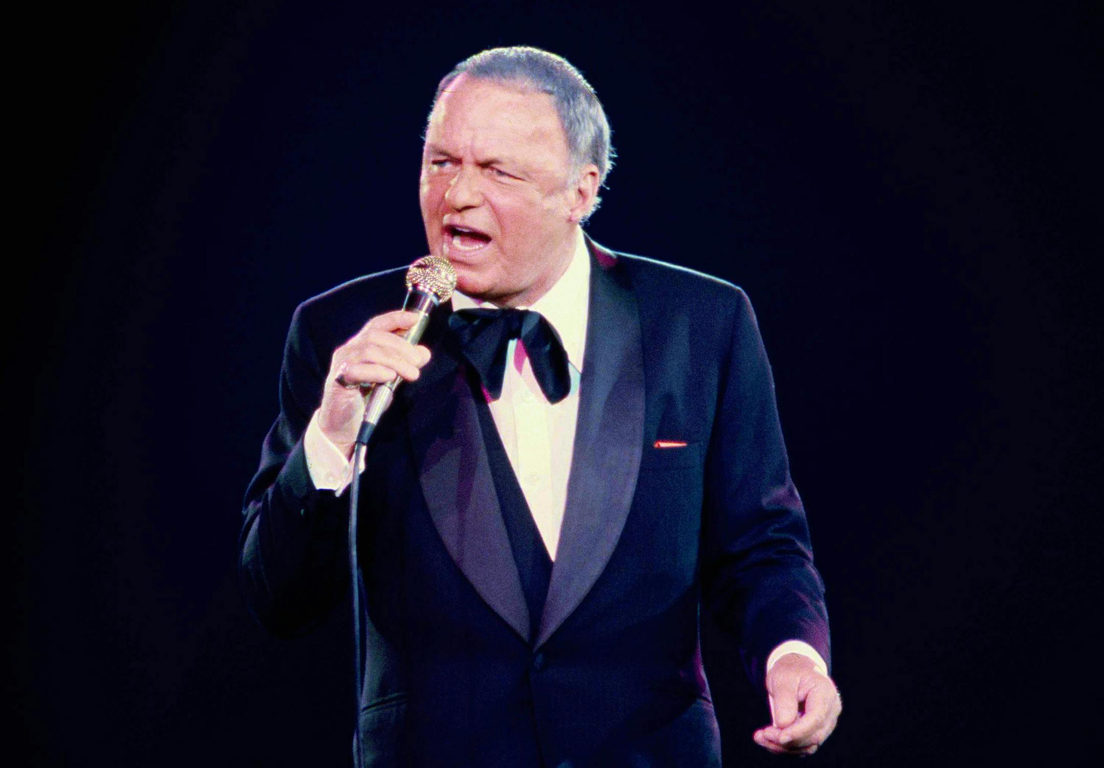 FILE - In this June 23, 1979 file photo, singer Frank Sinatra performs during his concert at the Nassau Coliseum, in Uniondale, N.Y. 100 is turning out to be a very good year for Sinatra. Wednesday night, Dec. 2, 2015, his birthday gets the star treatment with a live Grammy-produced concert at the Wynn resort-casino in Las Vegas. The two-hour concert airs Sunday from 9 to 11 p.m. EST/PST on CBS. (AP Photo/Richard Drew, File) ORG XMIT: CAET276