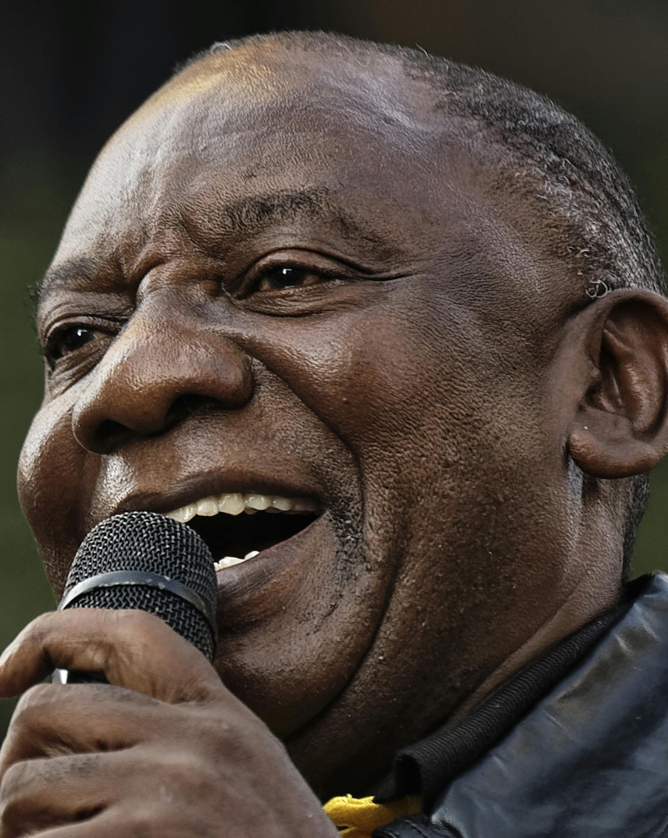 President Cyril Ramaphosa speaks at a victory rally for his African National Congress (ANC) party in downtown Johannesburg, South Africa Sunday, May 12, 2019. South Africa's president on Sunday vowed to purge his party of "bad and deviant tendencies" as he prepares to appoint a new Cabinet following a victory in national elections. (AP Photo/Ben Curtis) ORG XMIT: ABC110