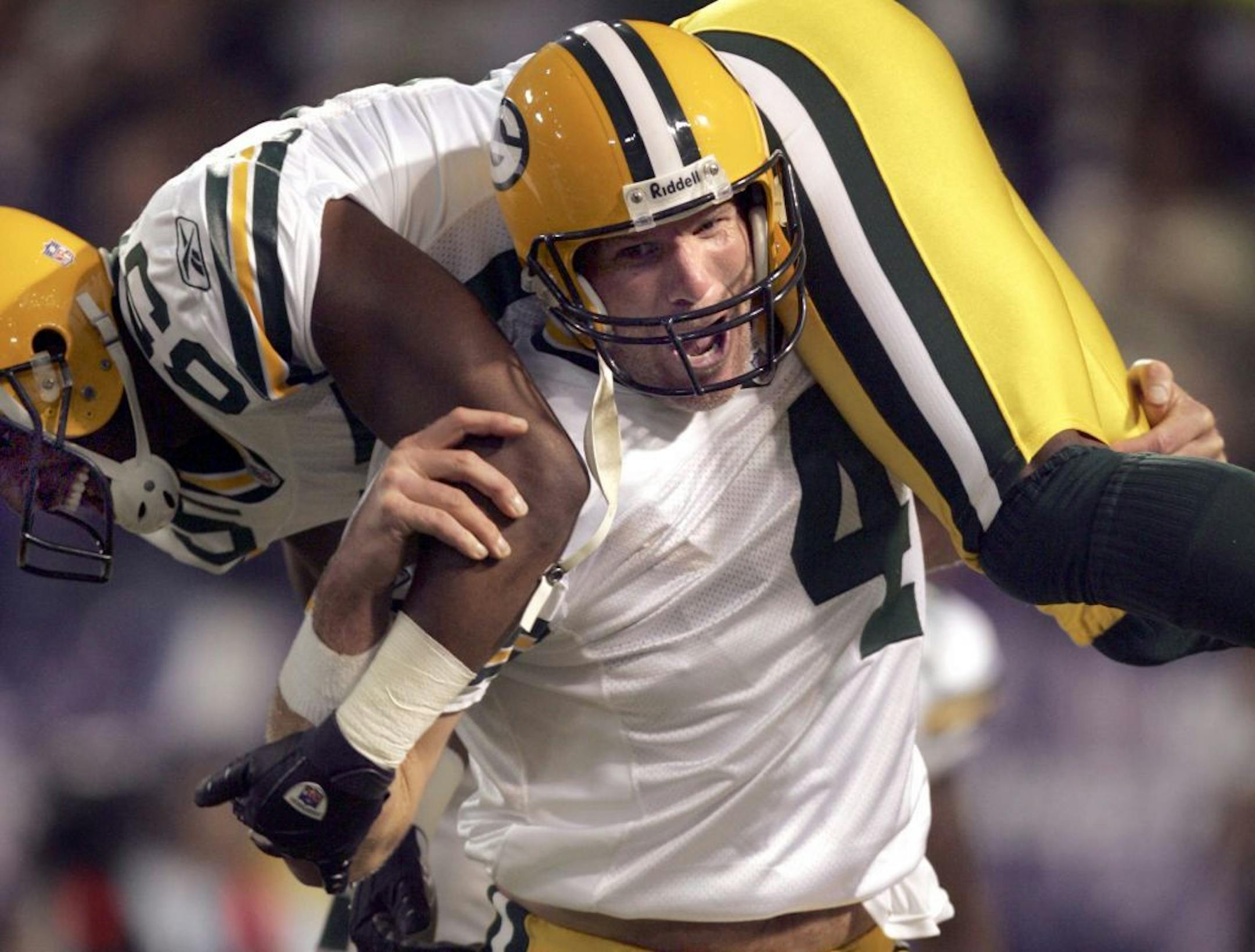 FILE: In 2007, Brett Favre carried receiver Greg Jennings after throwing a record setting 421st touchdown passes to break Dan Marino's record.