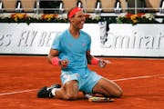 FILE - Spain's Rafael Nadal celebrates winning the final match of the French Open tennis tournament against Serbia's Novak Djokovic in three sets, 6-0