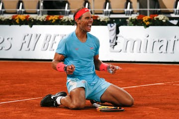 FILE - Spain's Rafael Nadal celebrates winning the final match of the French Open tennis tournament against Serbia's Novak Djokovic in three sets, 6-0