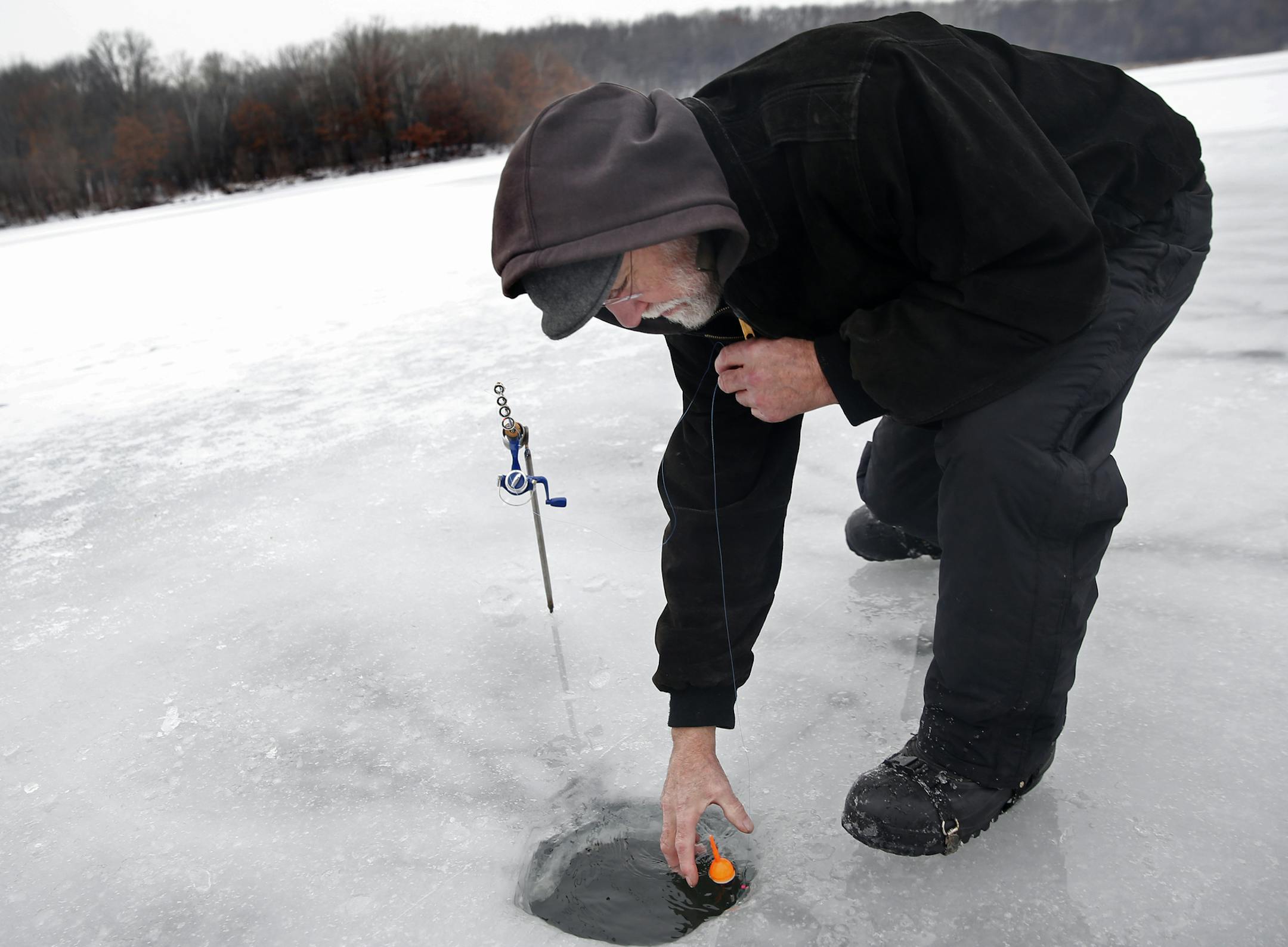 The convenient wilderness of the 2,000-acre Lebanon Hills Regional Park is beloved by visitors, many of whom fear Dakota County's new plan for the park focuses too much on development and too little on preservation. Erik Larsen, who was ice fishing, wants the park to stay as natural as possible .]Richard Tsong-Taatarii/ rtsong- taatarii@startribune.com