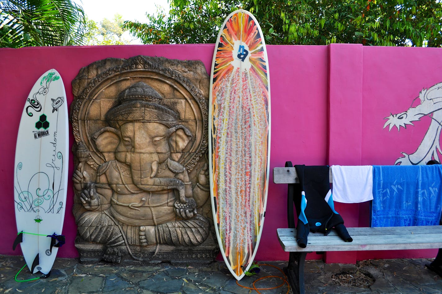 Surfboards at the all pink painted hostel