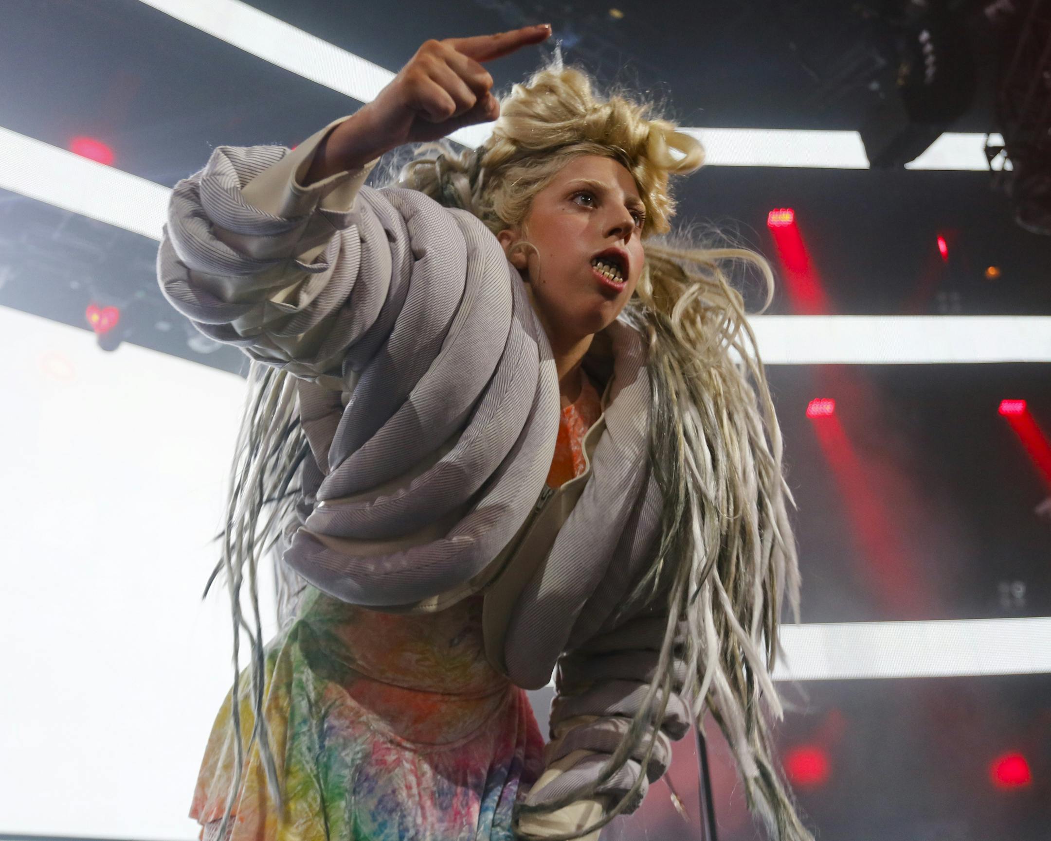 Lady Gaga makes an appearance during ZEDD's, not pictured, performance at the iTunes Festival Showcase during the SXSW Music Festival Friday March 14, 2014, in Austin, Texas. (Photo by Jack Plunkett/Invision/AP) ORG XMIT: TXJP208