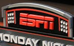 This Sept. 16, 2013, photo shows the ESPN logo prior to an NFL football game in Cincinnati. FuboTV has filed a lawsuit against ESPN, Fox, Warner Bros.