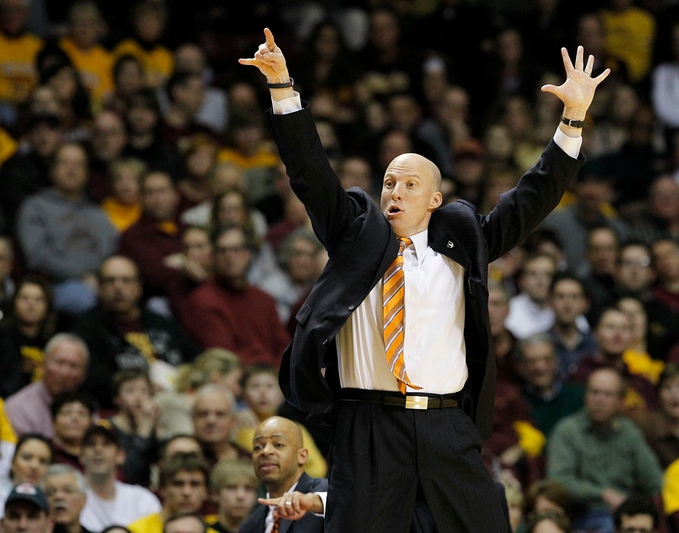 Illinois head coach John Groce calls out to his players during the second half of an NCAA college basketball game against Minnesota in Minneapolis, Saturday, Jan. 24, 2015. Minnesota won 79-71. (AP Photo/Ann Heisenfelt)