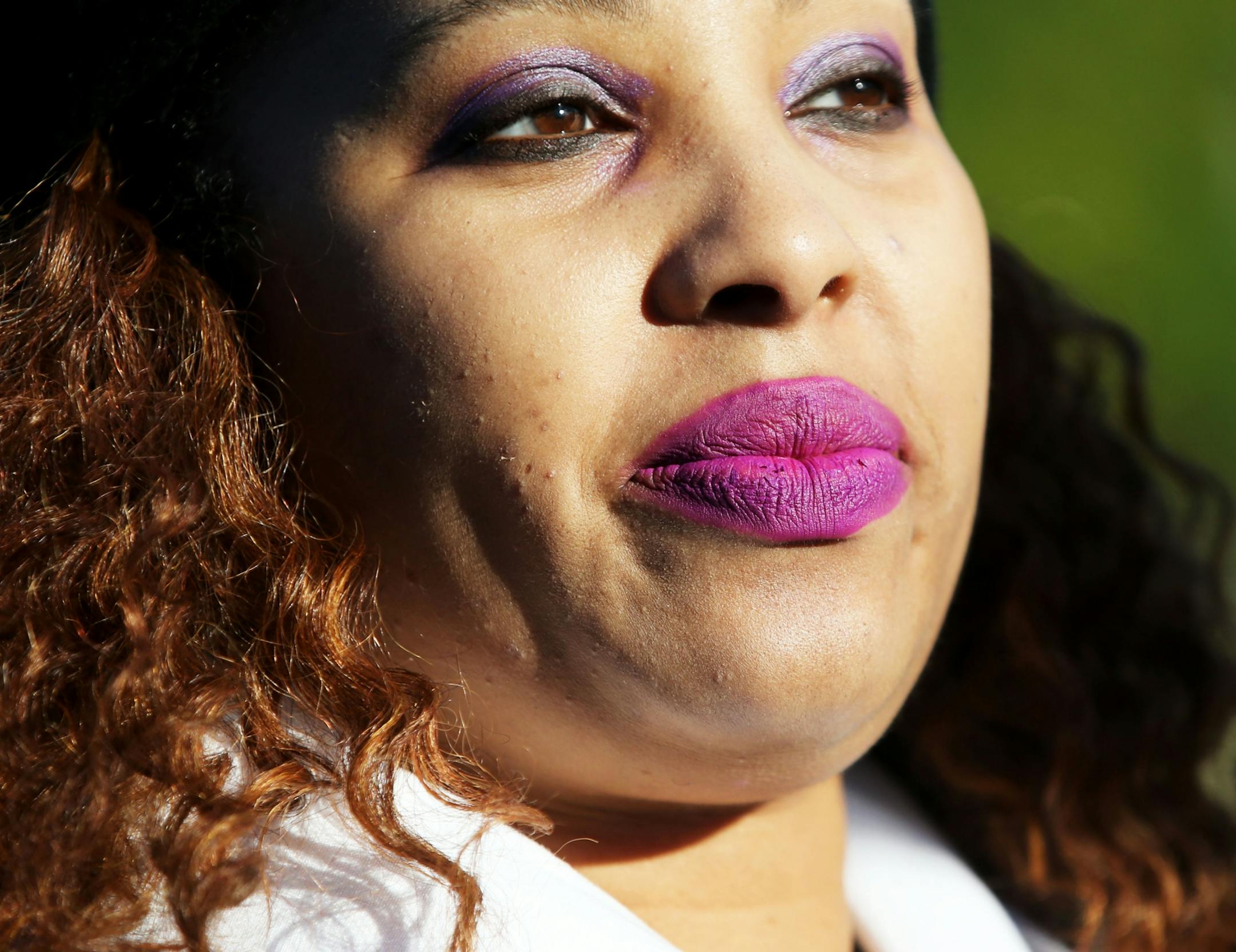 Stephanie Davis of FarmVille, Virginia, arrived wearing purple lipstick and eyeshadow for the first Paisley Park Tour Thursday, Oct. 6, 2016, in Chanhassen, MN.