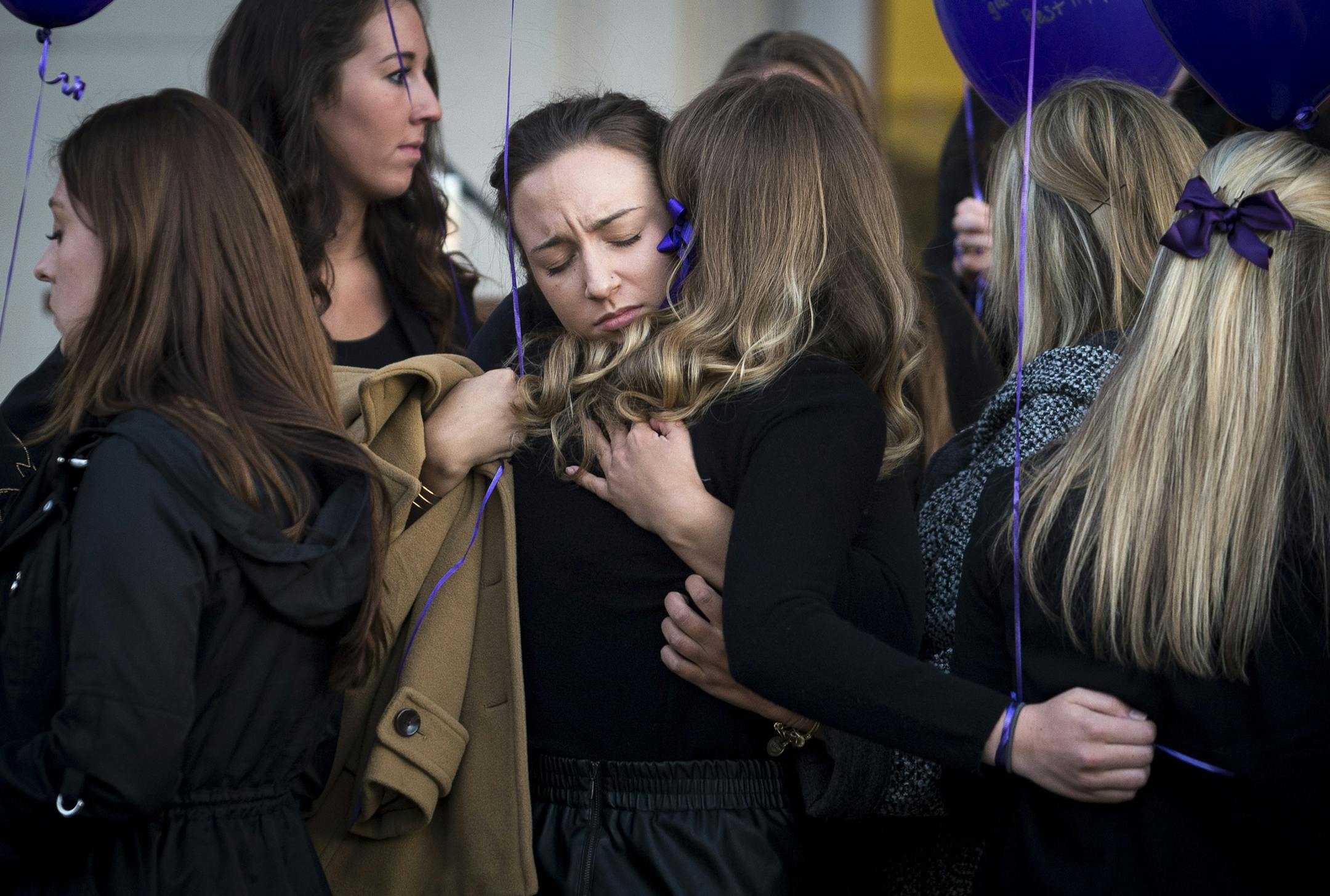 Sisters of Pi Beta Phi embrace each other before the start of Tuesday night's vigil honoring Jen Houle, ] (Aaron Lavinsky | StarTribune) The University of Minnesota and the sisters of Pi Beta Phi came together on Tuesday, March 31, 2015 to honor Jen Houle, the U student who apparently killed herself last week.