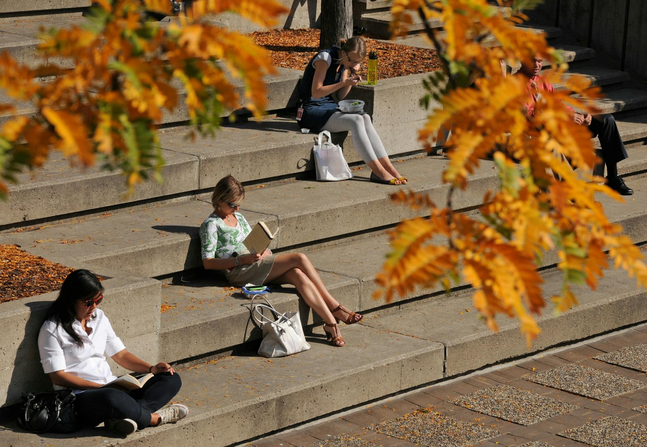Minneapolis, MN. Tuesday 10/12/10 The unusually warm fall weather continues to be ideal for chores to lunching on the street.Peavey Plaza was a popular place to have lunch or read