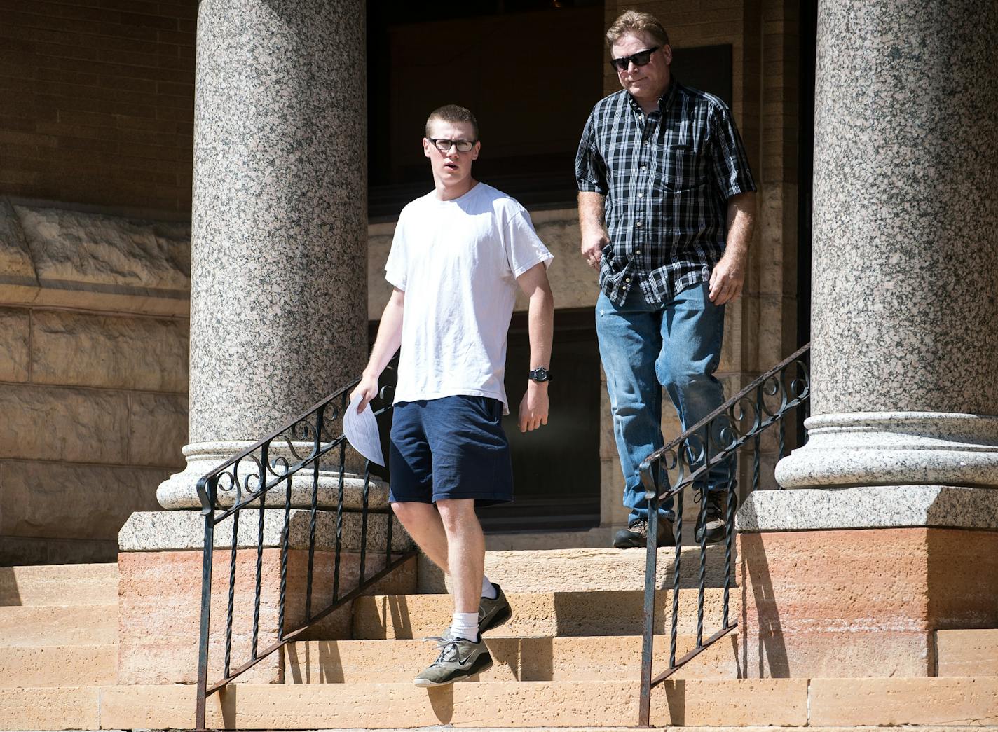 John Ladue and his father, David, walked down the steps in front of the Waseca County Courthouse after John's visit to court to execute his sentence Tuesday afternoon. ] (AARON LAVINSKY/STAR TRIBUNE) aaron.lavinsky@startribune.com John Ladue went back to court to execute his sentence on Tuesday, July 26, 2016 in Waseca, Minn.