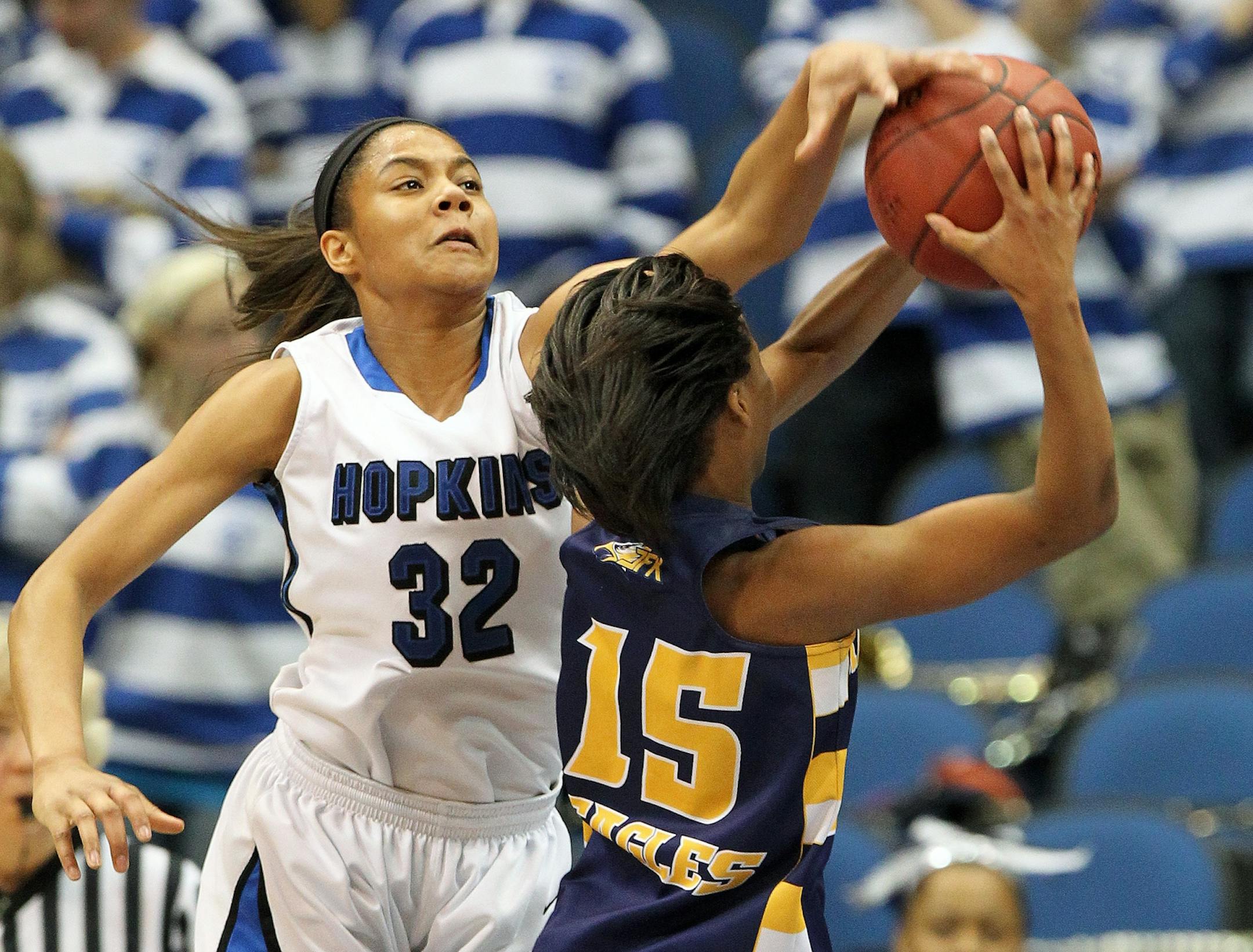 Nia Coffey (32) blocked the shot of Kennedy's Kenisha Bell.