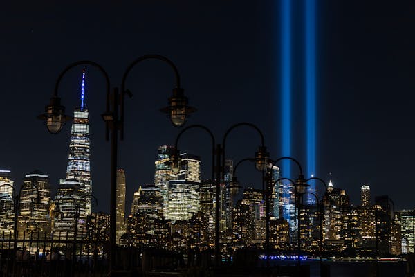 Columns of light representing the fallen towers of the World Trade Center shine against the lower Manhattan skyline on the 19th anniversary of the Sep