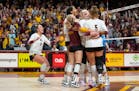 The Minnesota volleyball team celebrates after the game winning point in the fourth set to defeat Purdue 3-1 Saturday, Oct. 22, 2022 at Maturi Pavilio