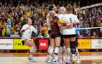 The Minnesota volleyball team celebrates after the game winning point in the fourth set to defeat Purdue 3-1 Saturday, Oct. 22, 2022 at Maturi Pavilio