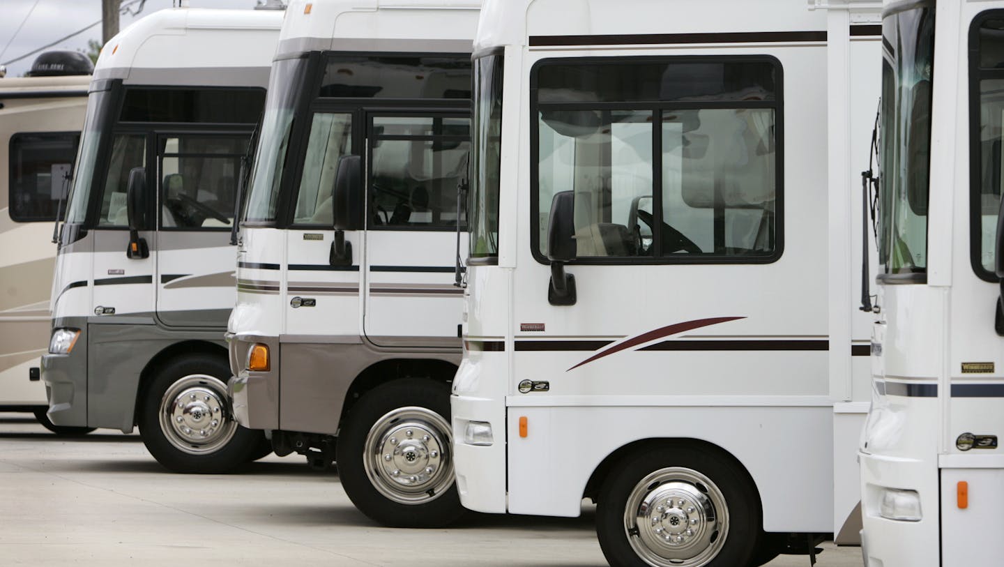 FILE - In this Wednesday, June 15, 2005, file photo, Winnebago motor homes are shown on a lot, in Jefferson, Iowa. Led by sales growth for towable RVs and pricier stand-alone motor homes, recreational vehicle makers expect to ship more than 300,000 units to dealers in 2013 for the first time since the economic downturn. (AP Photo/Charlie Neibergall, File)