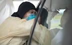 Cheryl Odegaard, a medical assistant at St. Luke's Respiratory Clinic, administered a COVID-19 test to a patient in their drive thru testing site on T