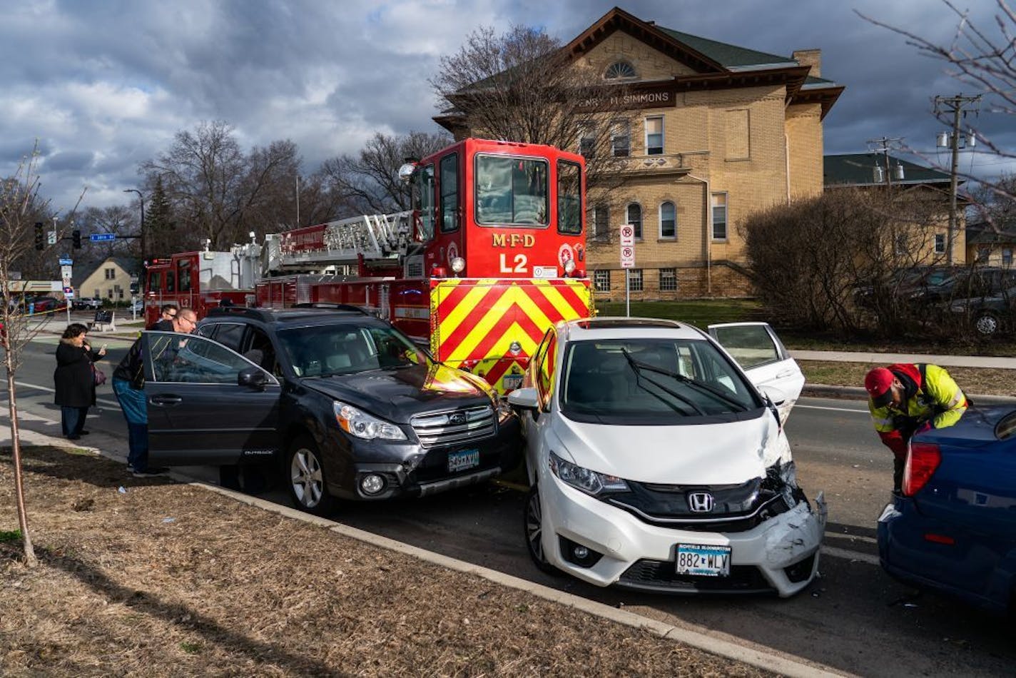 A witness said the rear of the ladder truck crossed into oncoming lanes of traffic impacting several vehicles.