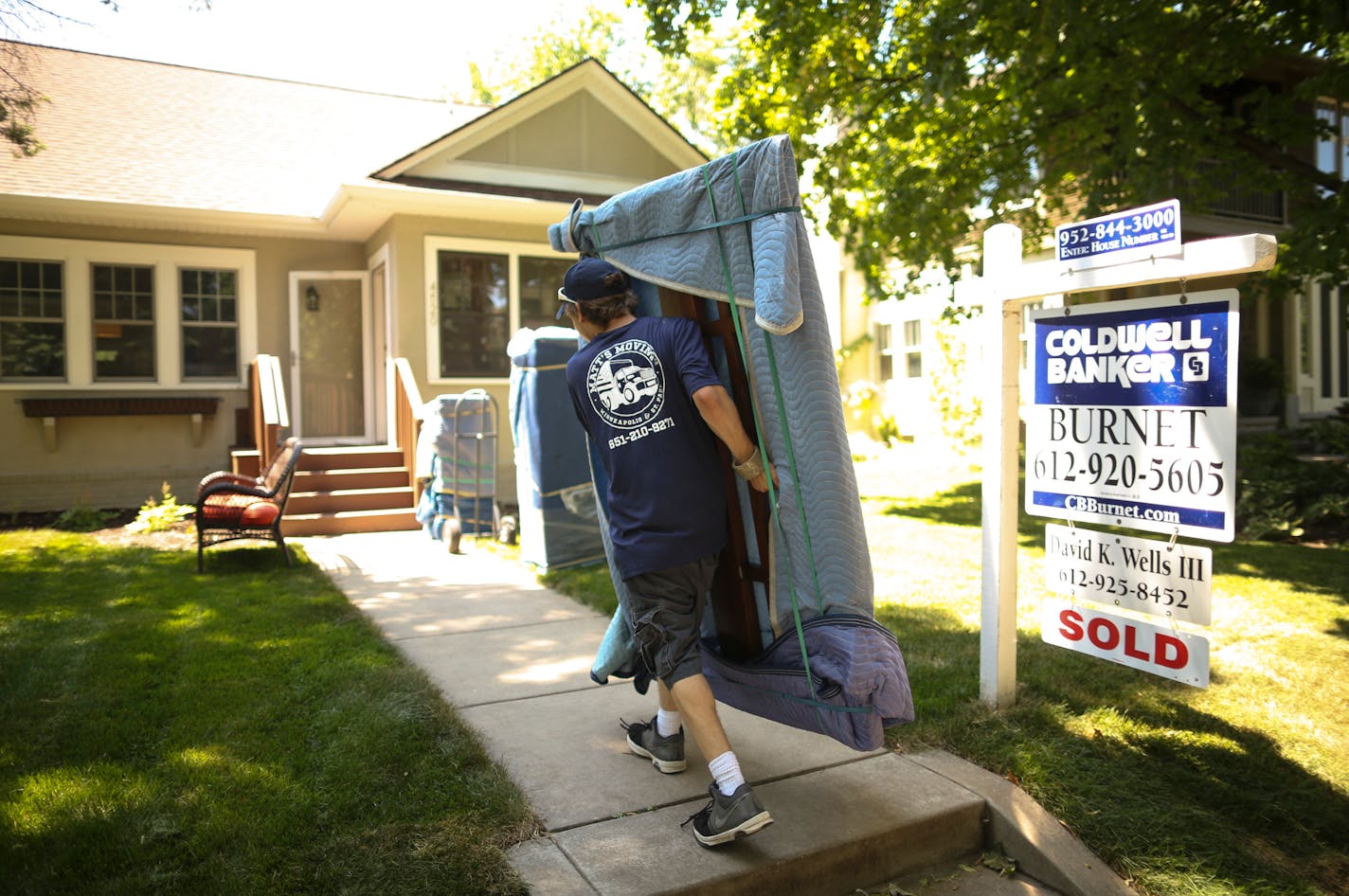 Justin Nelson of Matt's Moving carried a headboard as they moved Justin and Maggie Dering into their new Minneapolis house in June. ] JEFF WHEELER � jeff.wheeler@startribune.com Justin and Maggie Dering and their two kids moved into their new home in southwest Minneapolis Sunday, June 19, 2016. When they made their offer on the house, because of the frenzied spring market, it was for $25,000 more than the asking price of $625,000.