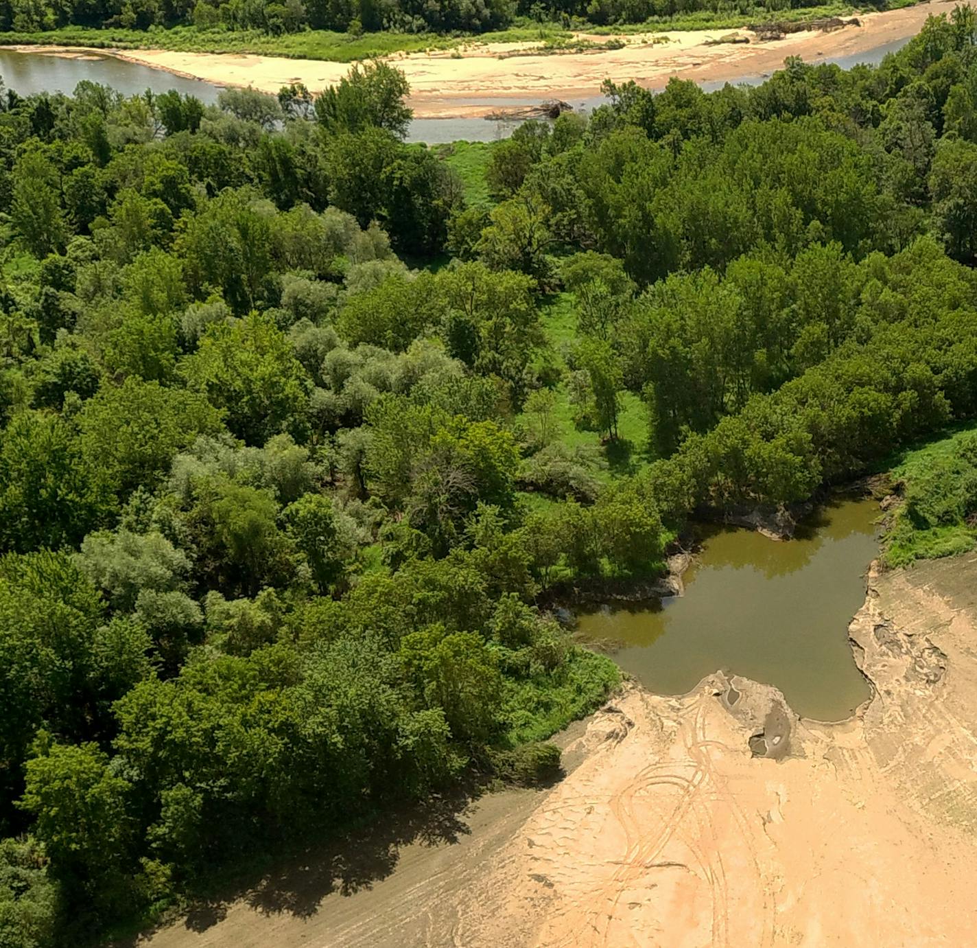 Aerial drone photos show what the Zumbro River left behind over Albert Carlson's 120 acres near Theilman, Minn. Record rainfall upriver and rapid meltoff raised the river.