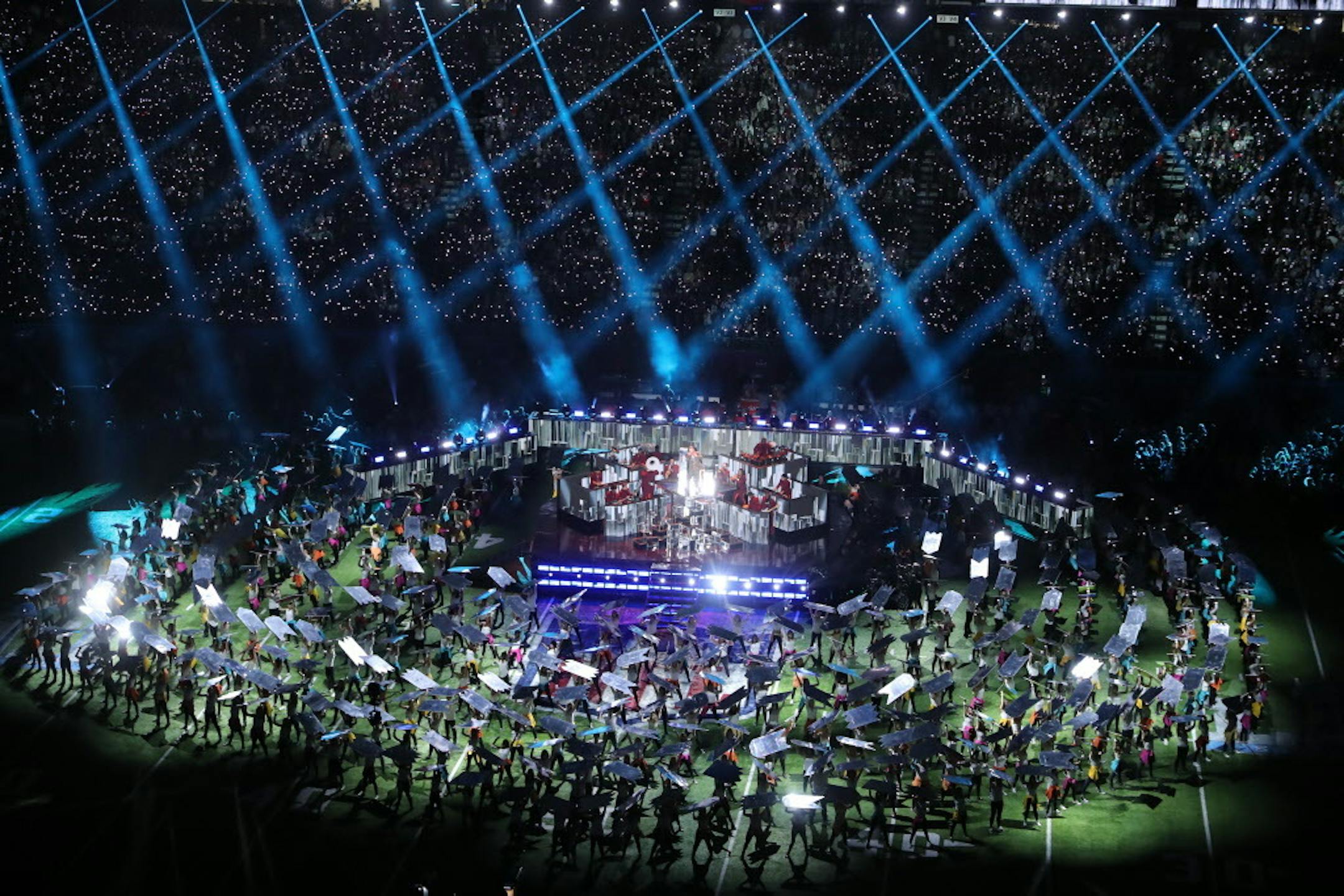 Justin Timberlake pays tribute to Prince, singing "I Would Die 4 U," as video of the music icon performing in "Purple Rain" is projected on a large screen during the Super Bowl halftime show.