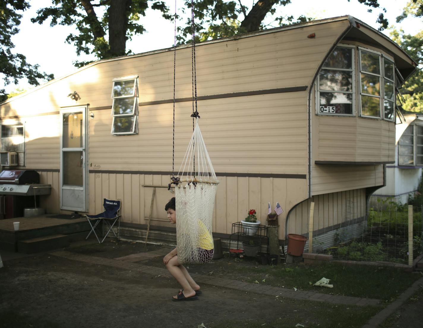 Edwin Morales sat in a chair suspended from a tree outside the mobile home he lives in at Lowry Grove. ] JEFF WHEELER &#xef; jeff.wheeler@startribune.com Manufactured homes are often the only affordable housing in many suburbs. They also provide the only glimmer of ethnic and racial diversity, but their numbers are declining in the Twin Cities. Preserving these communities should be a priority, according to a new Met Council report. The report comes out as news of the latest park closure in St.