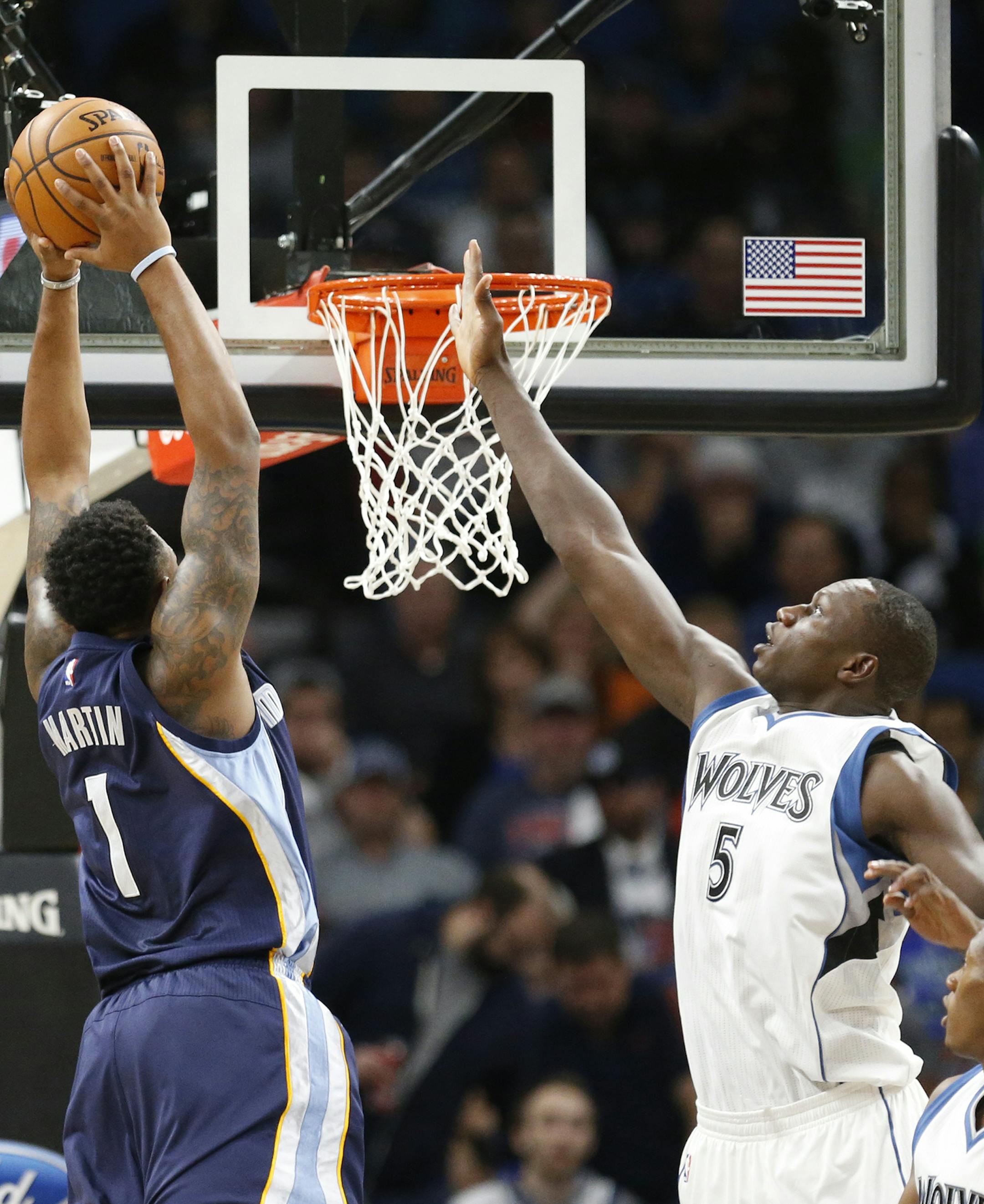 Memphis Grizzlies forward Jarell Martin (1) shoots as Minnesota Timberwolves center Gorgui Dieng (5) defends during the first half. ] (Leila Navidi/Star Tribune) leila.navidi@startribune.com BACKGROUND INFORMATION: The Minnesota Timberwolves play the Memphis Grizzlies at Target Center in Minneapolis on Tuesday, November 1, 2016.