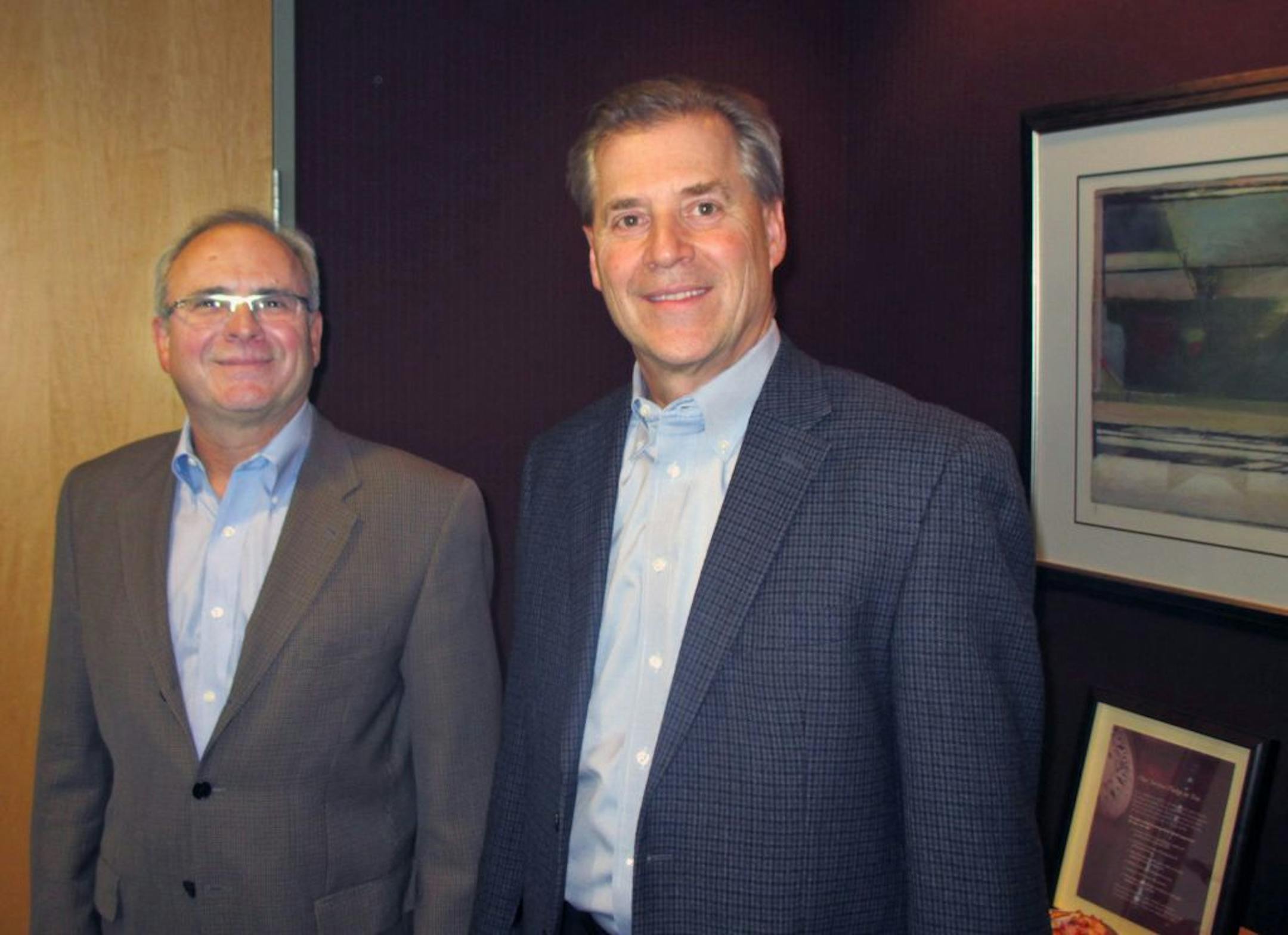 IDs: Richard Burrock, lead partner, business succession services, left; Mark DeNucci, managing partner, right. Both of Boulay, an accounting and consulting firm in Eden Prairie. For small0331. Names, titles cq. Thanks.