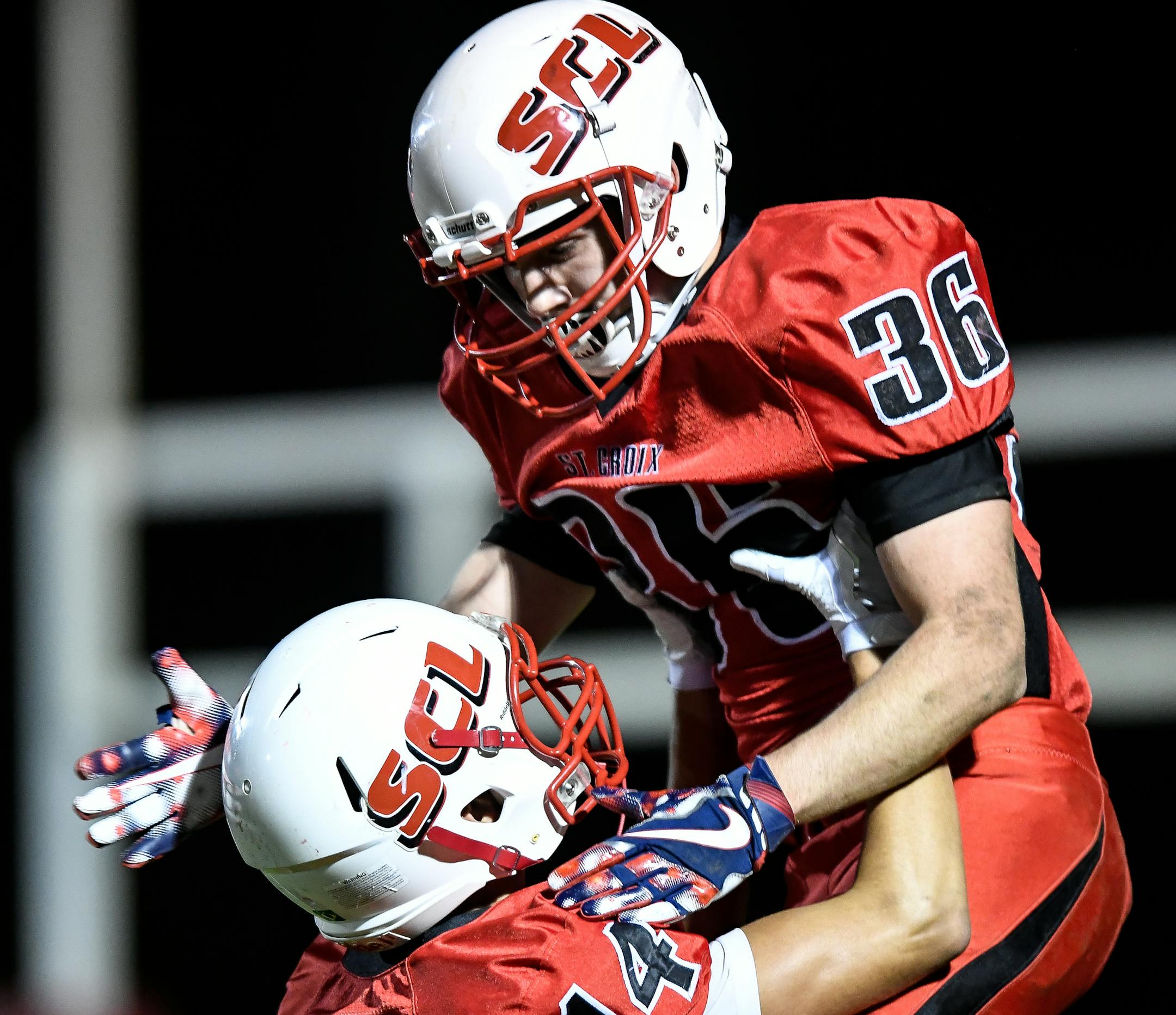 St. Croix Lutheran running back James Chernohorsky (36) celebrated with wide receiver Thiago Carvalho (14) after a touchdown by Chernohorsky in the second quarter against Mound Westonka. ] AARON LAVINSKY ï aaron.lavinsky@startribune.com St. Croix Lutheran played Mound Westonka in a high school football game on Friday, Oct. 13, 2017 at St. Croix Lutheran High School in West. St. Paul, Minn.