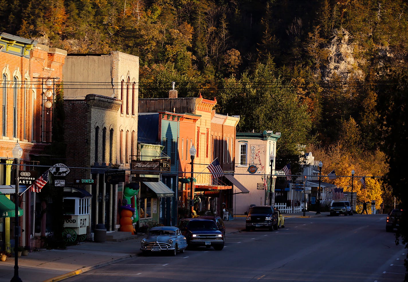 Lanesboro, nestled below the bluffs of the Root River Valley. ] Minnesota State of Wonders travel Project - South East Minnesota Bluff Country.