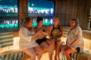 Linda Irwin, from left, Tonya Erickson, Marie Rivers, and Susan Erickson enjoyed their sauna time in Cedar and Stone’s new sauna barge near Pier B, 