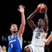 United States's Jrue Holiday (12) drives to the basket between the Czech Republic's Tomas Satoransky (8) and Jan Vesely (24) during a men's basketball