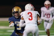 Maxwell Woods (left) of Chanhassen, a shutdown cornerback on top of being a standout running back, put a hit on Jalen Smith of Mankato West.