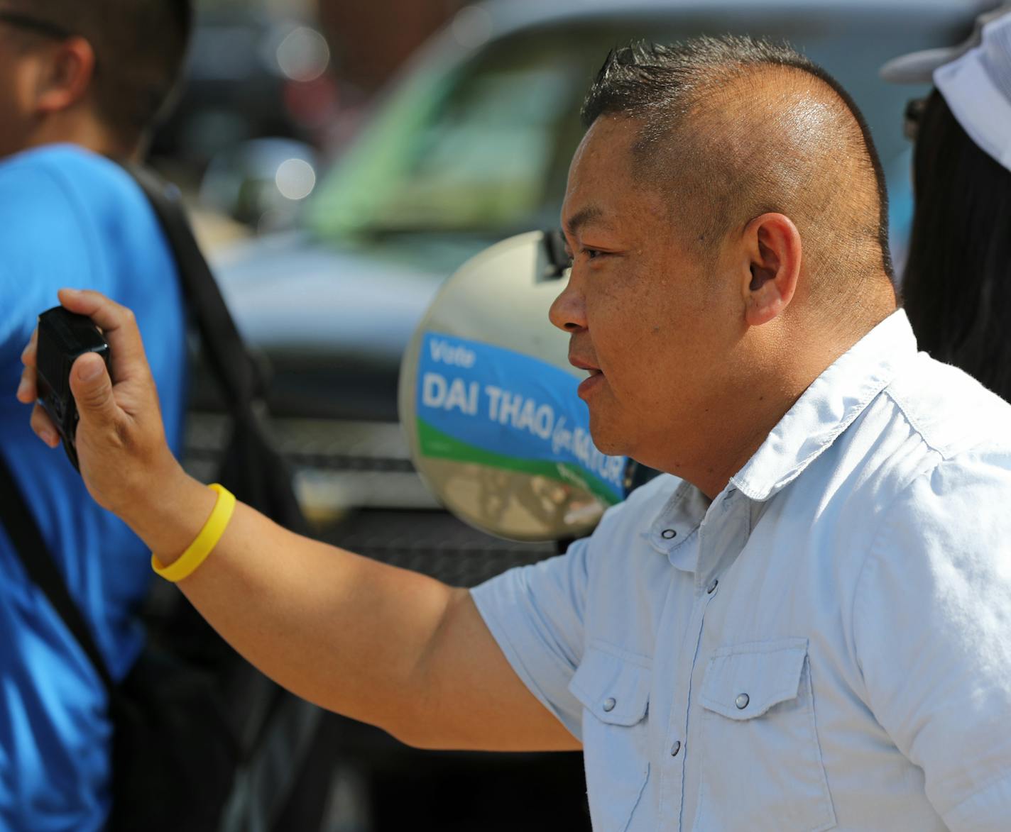 St. Paul mayoral candidate Dai Thao spoke to volunteers before the start of the Payne Arcade Harvest Festival and Parade. ] Shari L. Gross &#xef; shari.gross@startribune.com Profile of St. Paul mayoral candidate Dai Thao. Dai Thao at a parade on Payne Ave in St. Paul. Something tight of his face and then something of Thao in action.