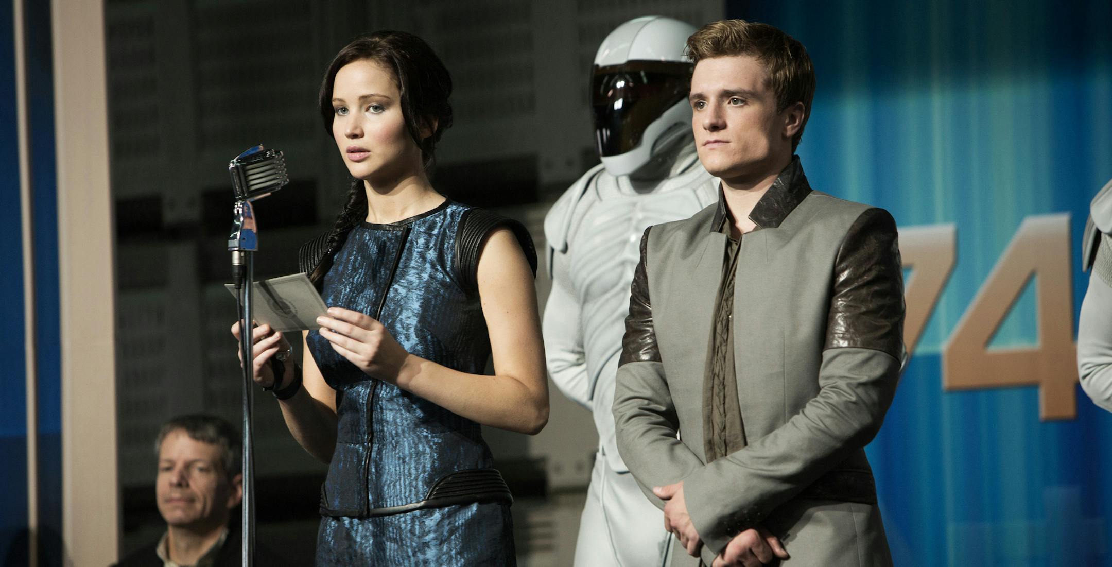 This publicity photo released by Lionsgate shows Jennifer Lawrence, left, as Katniss Everdeen and Josh Hutcherson as Peeta Mellark in a scene from the film, "The Hunger Games: Catching Fire." (AP Photo/Lionsgate, Murray Close) ORG XMIT: MIN2013072315022870