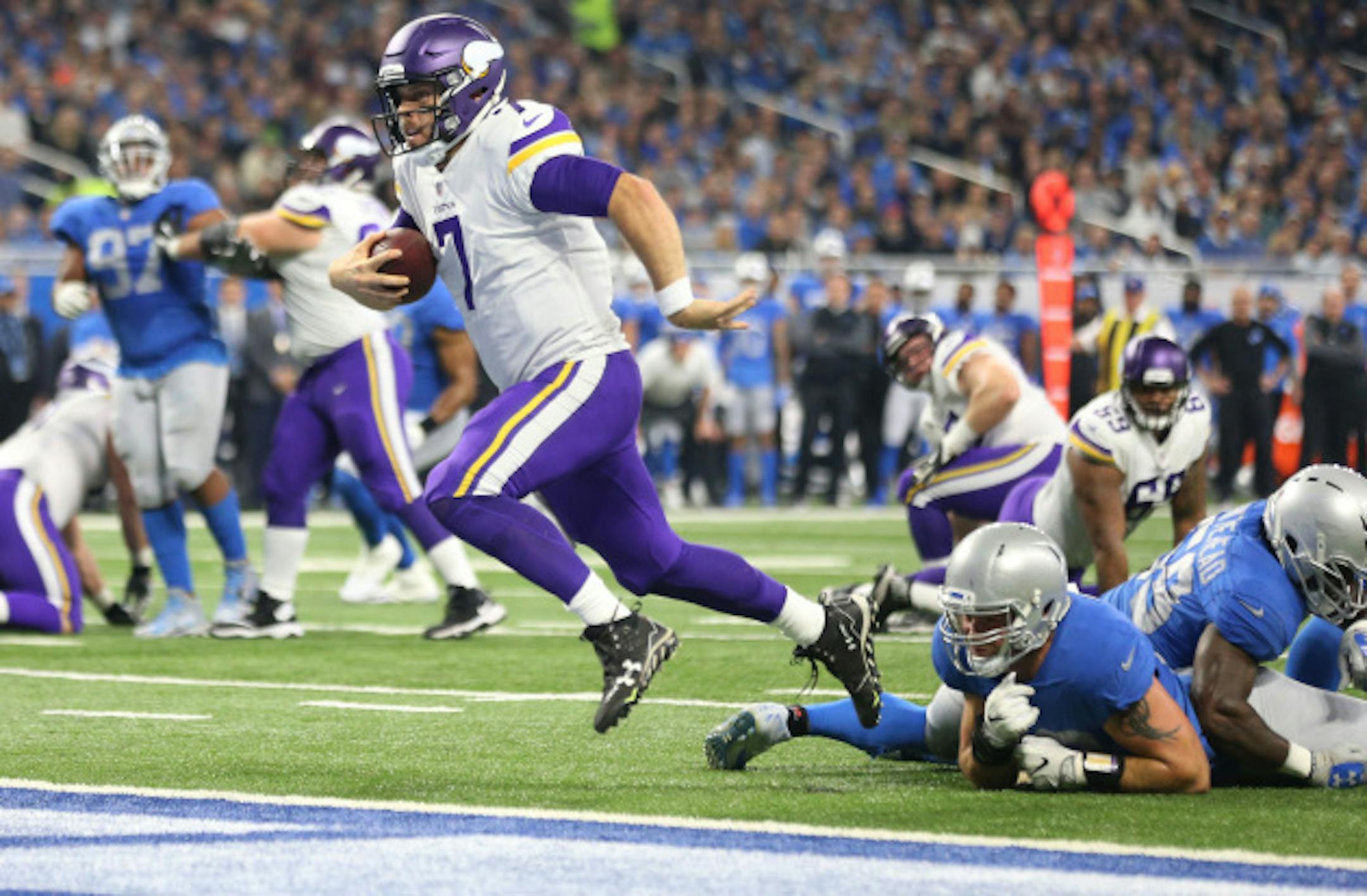 Minnesota Vikings quarterback Case Keenum (7) split two Lions defenders for a first quarter touchdown at Ford Field Thursday November 23, 2017 in Detroit , MI.] The Detroit Lions hosted the Minnesota Vikings Thanksgiving day.JERRY HOLT ' jerry.holt@startribune.com