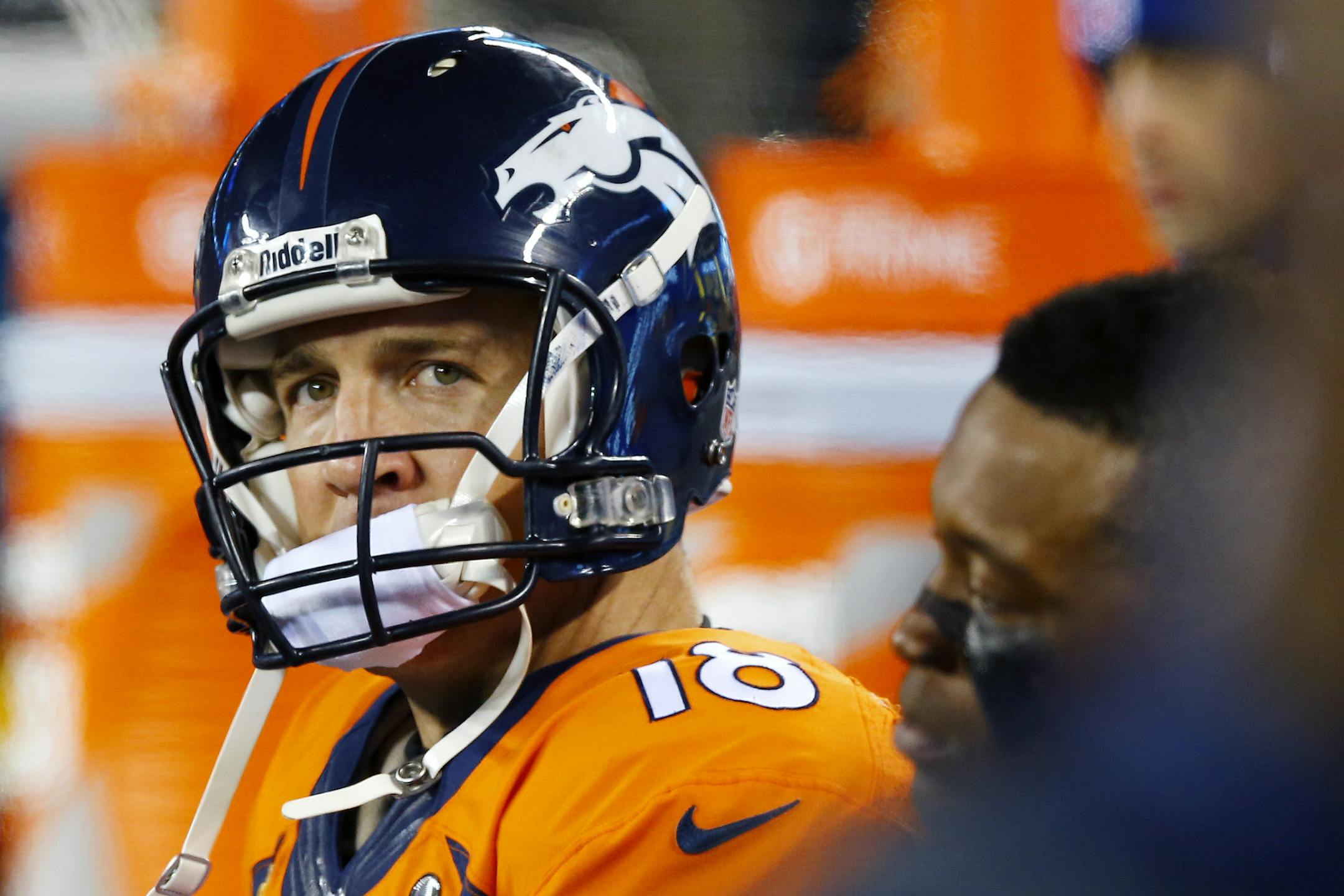 Denver Broncos' Peyton Manning watches from the bench during the second half of the NFL Super Bowl XLVIII football game against the Seattle Seahawks Sunday, Feb. 2, 2014, in East Rutherford, N.J. (AP Photo/Paul Sancya)