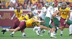 Minnesota's linebackers Carter Coughlin, left, and Jack Lynn stopped Colorado State's quarterback Collin Hill in the second quarter as the Gophers too