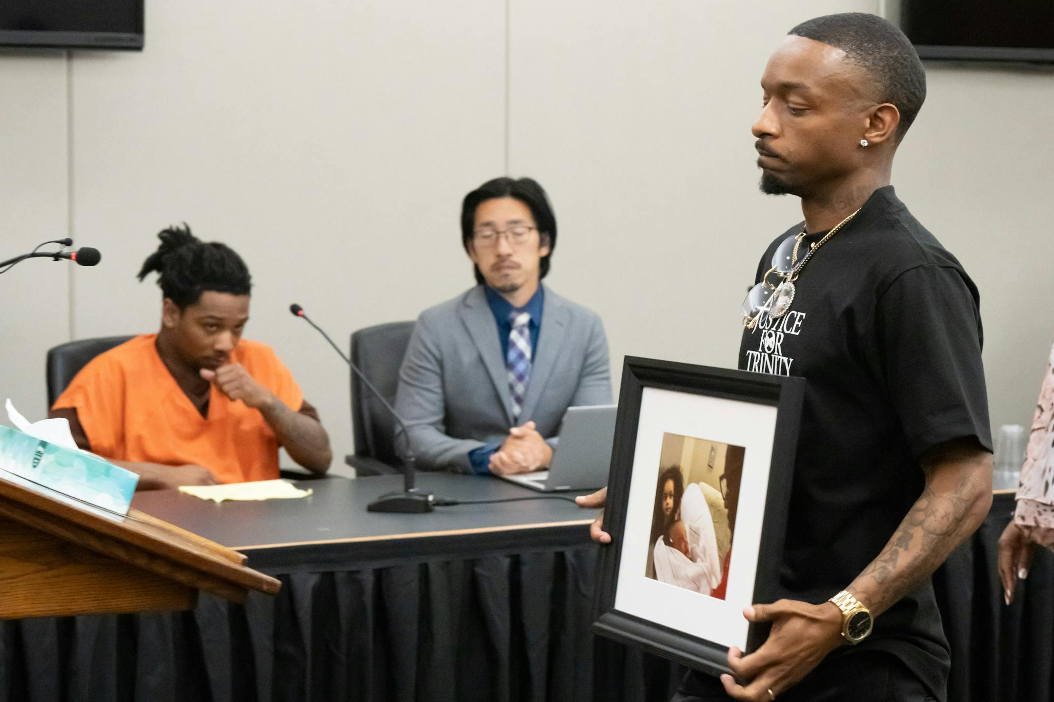 D'Pree Robinson watched as Trinity's father Raishawn Smith approached the court to speak about his daughter Tuesday, July 11, 2023 in Minneapolis. D'Pree Robinson was sentenced to 37 1/2 years for the killing of 9-year-old Trinity Ottoson-Smith.