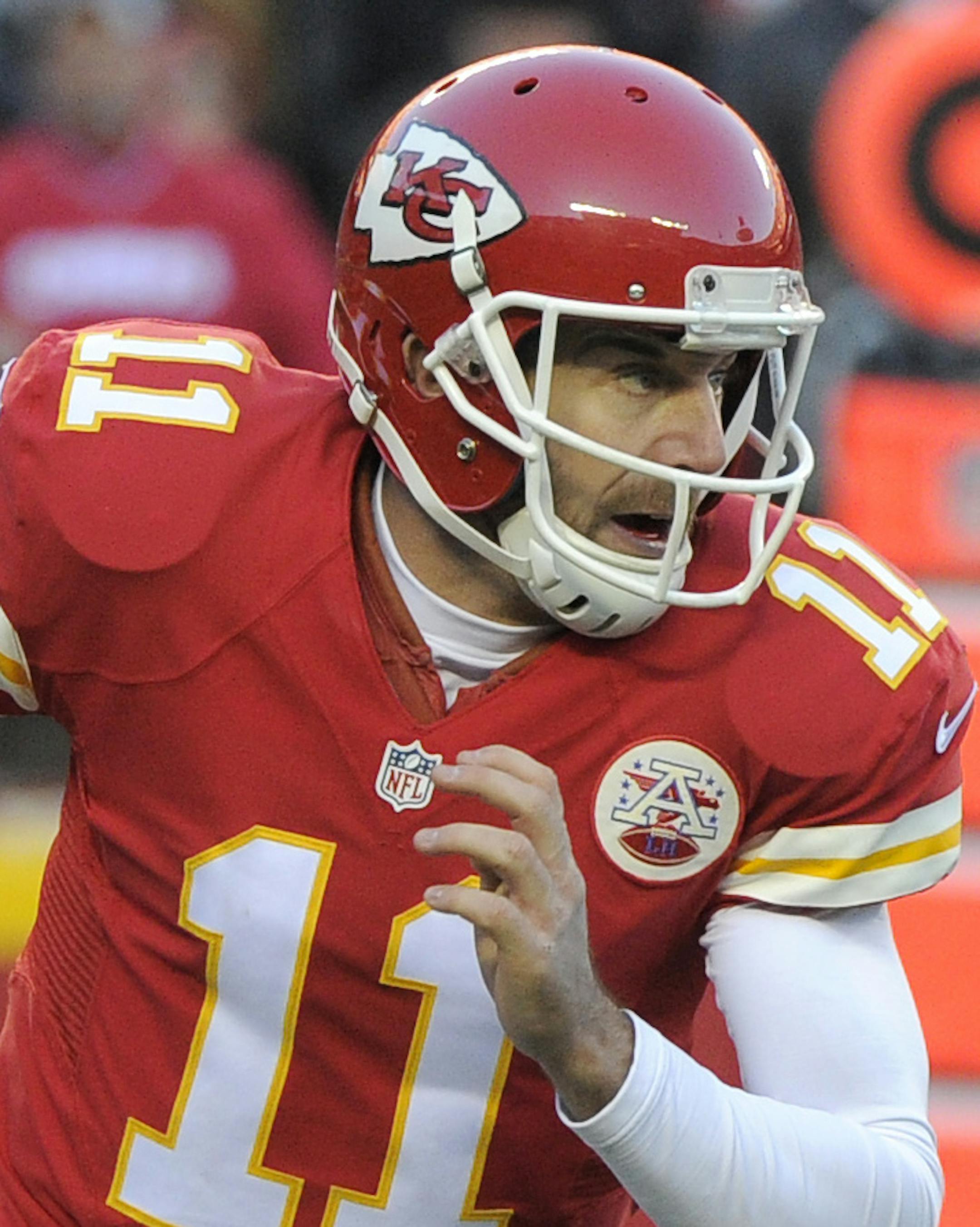 Kansas City Chiefs quarterback Alex Smith (11) runs with the ball during the first half of an NFL football game against the Oakland Raiders in Kansas City, Mo., Sunday, Jan. 3, 2016. (AP Photo/Ed Zurga) ORG XMIT: MONH112