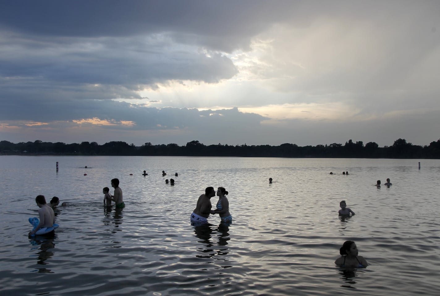 With the temperature still at 100, Late Sunday, folks were still hanging out in the east side swimming hole of lake Nokomis.