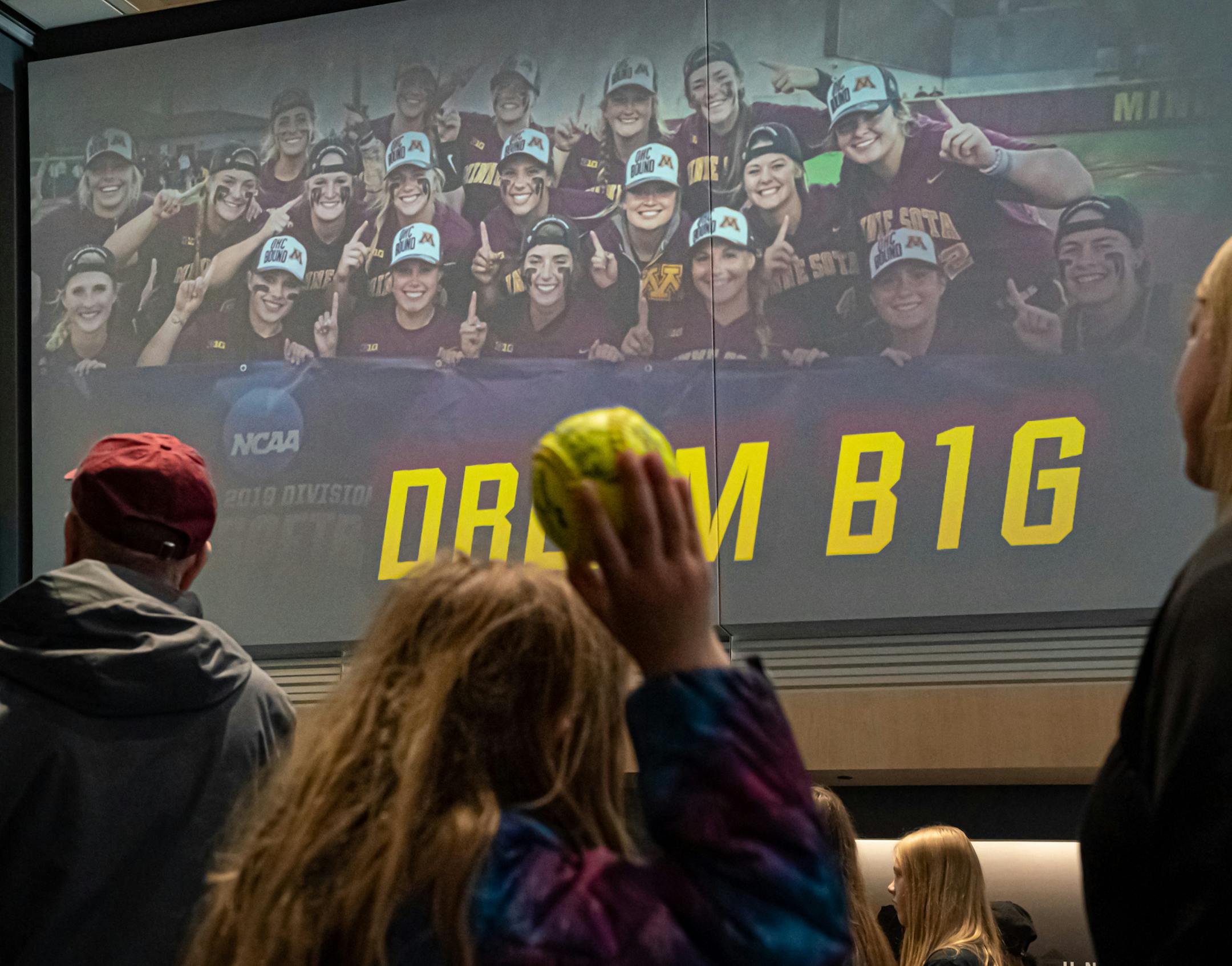 Madelyn Youngquist, 7, held her autographed softball in the air as coaches talked to the fans gathered as the Gophers softball team has a rally/autograph session before heading to Oklahoma City for the Women's College World Series. This was in the lobby of the Athletes Village. ] GLEN STUBBE &#x2022; glen.stubbe@startribune.com Tuesday, May 28, 2019 The Gophers softball team has a rally/autograph session before heading to Oklahoma City fo the Women's College World Series. This will be in the lob