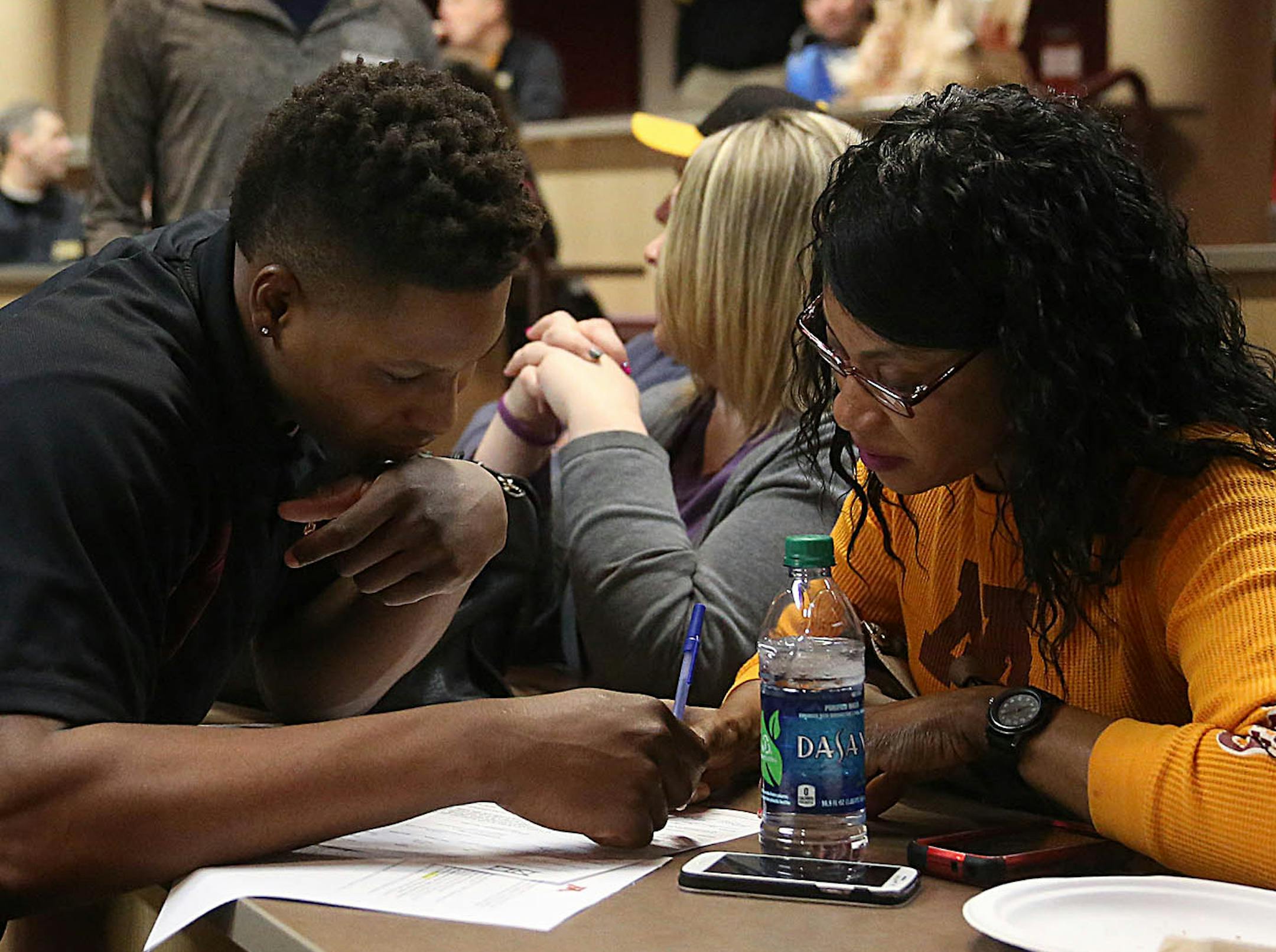 Kamal Martin and his mother, Maxine Martin, looked over the national letter of intent he signed Wednesday.