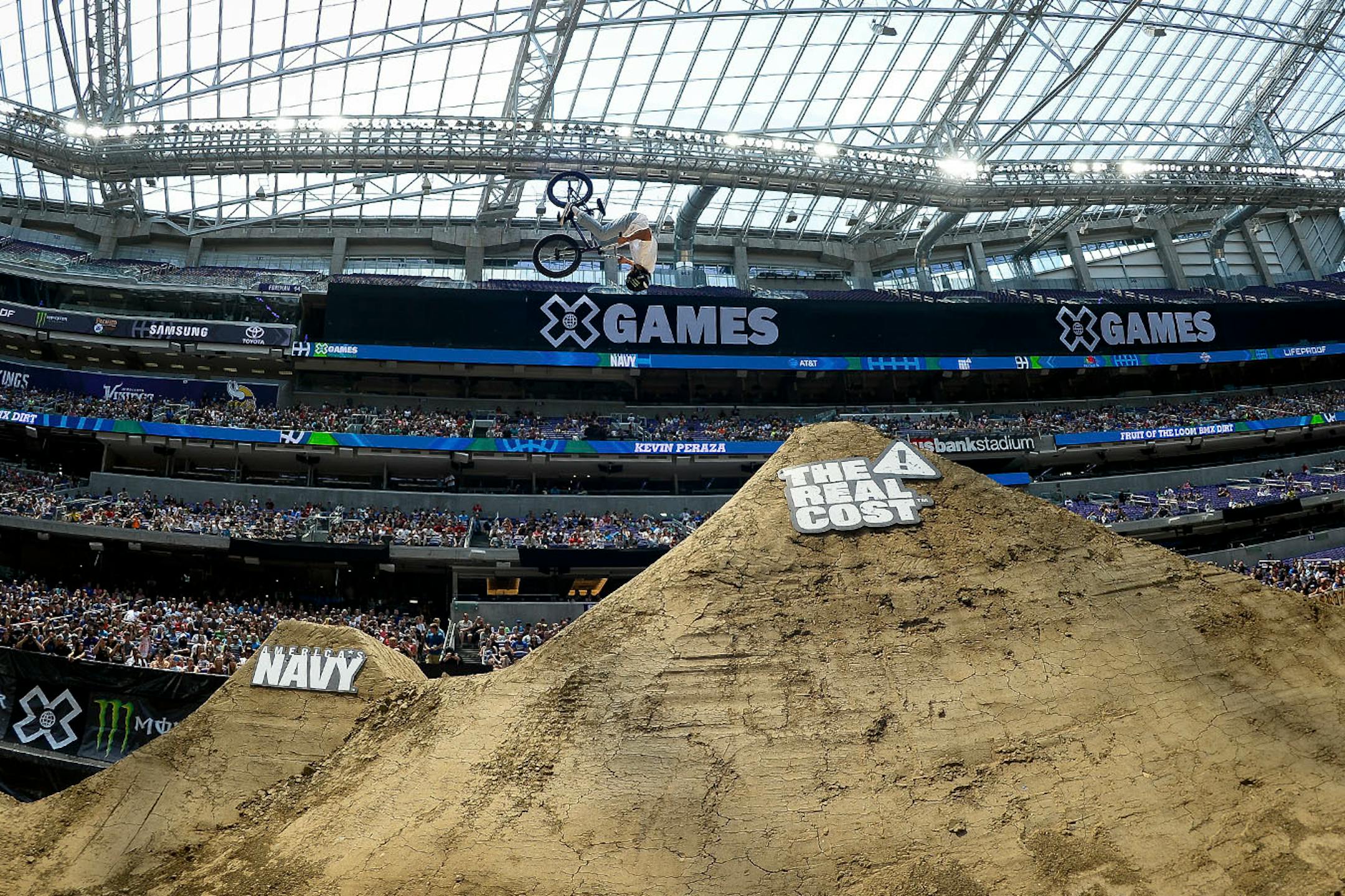 Kevin Peraza attempted a front flip in his third run of the BMX dirt finals Sunday.