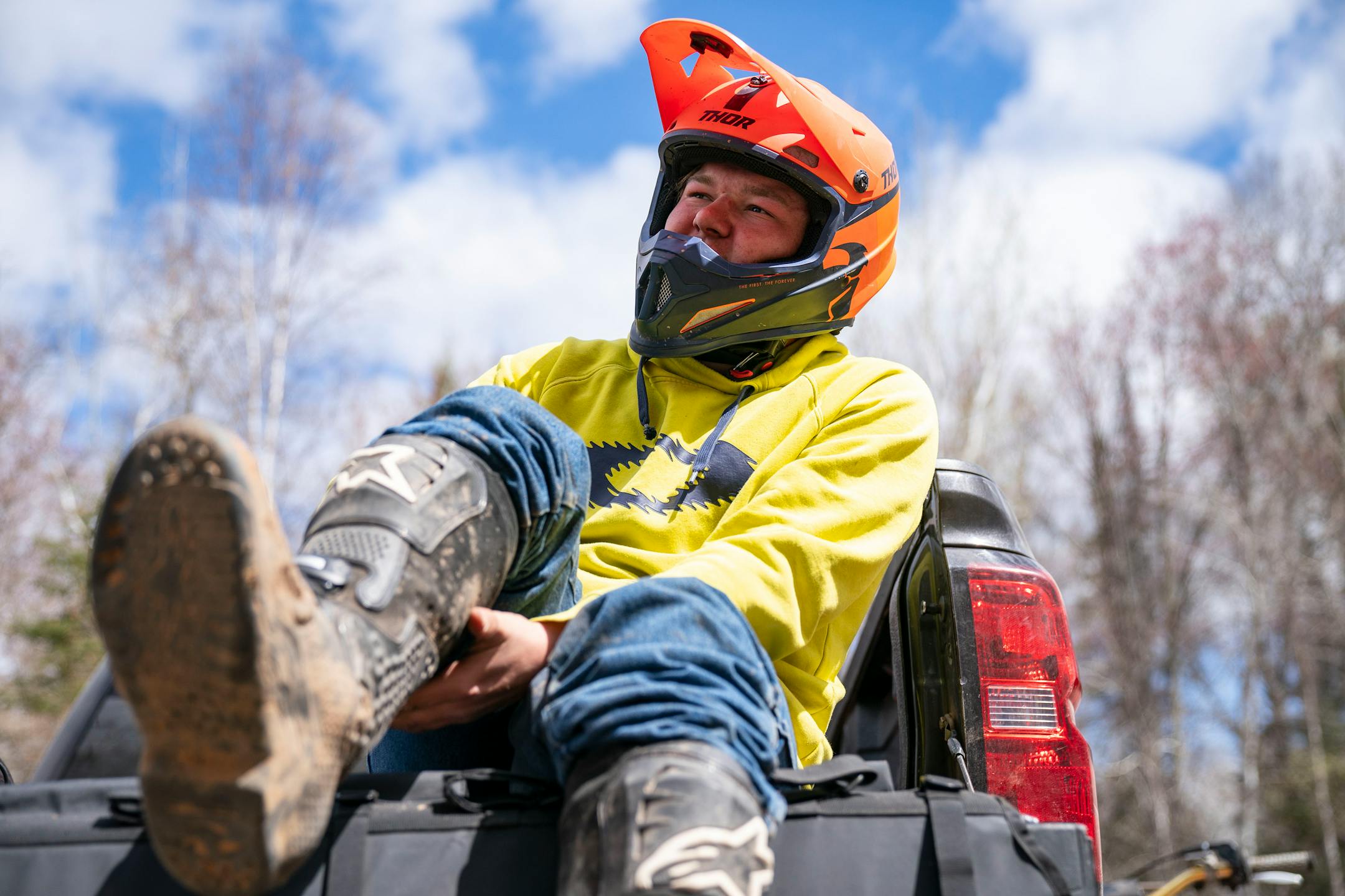 Baylor Litsey put his gear on before riding his dirt bike on a trail through the Nemadji Forest on Friday Sunday, May 7, 2021. ]