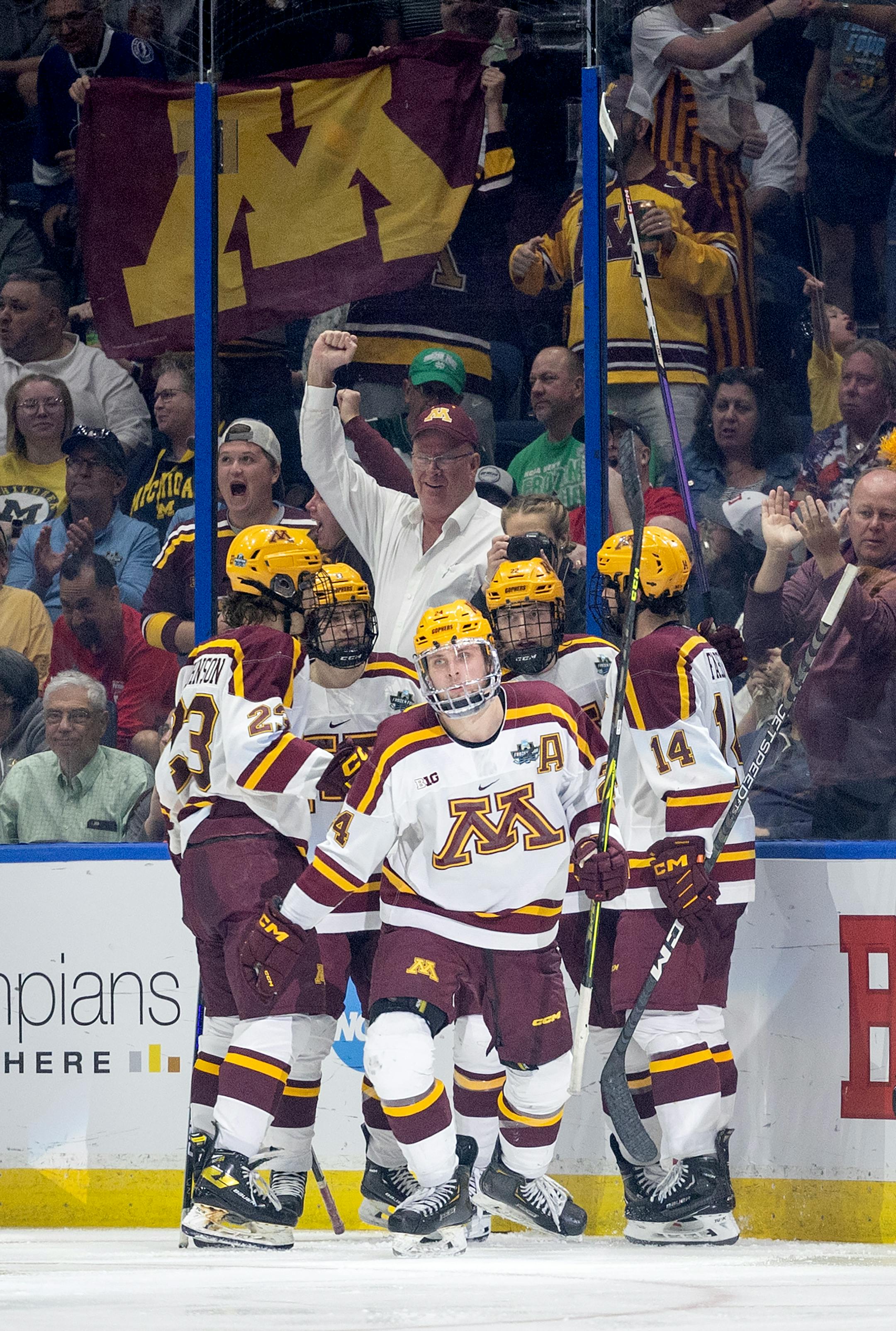 Jaxon Nelson (24) of Minnesota celebrates with teammates after scoring in the second period