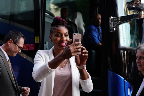 Angel McCoughtry took video with her phone as she arrived on the orange carpet at the WNBA All-Star Game in Minneapolis in 2018.