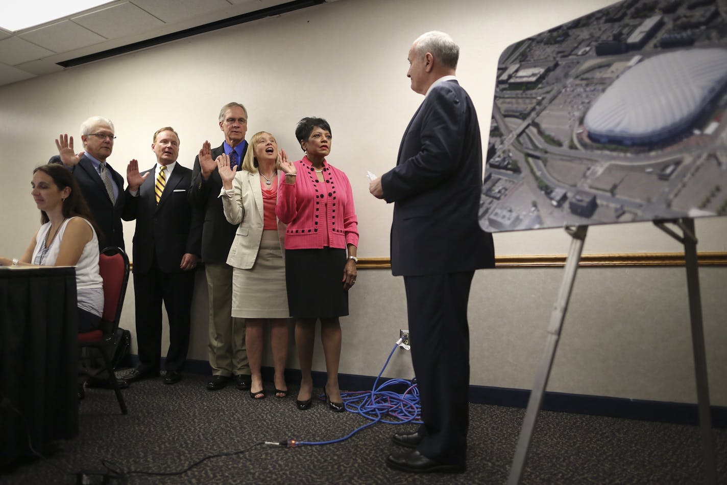 The newly-created 5-member Minnesota Sports Facilities Authority that will oversee construction of the new Vikings stadium was sworn in by Gov. Mark Dayton on Friday, June 22, 2012 at the Halsey Hall Room in the Metrodome in Minneapolis, Minn. From the left standing, Bill McCarthy, John Griffith, Duane Benson, Michele Kelm-Helgen and Barbara Butts-Williams. And GOv. Mark Dayton at right. ](RENEE JONES SCHNEIDER &#x2022; reneejones@startribune.com)