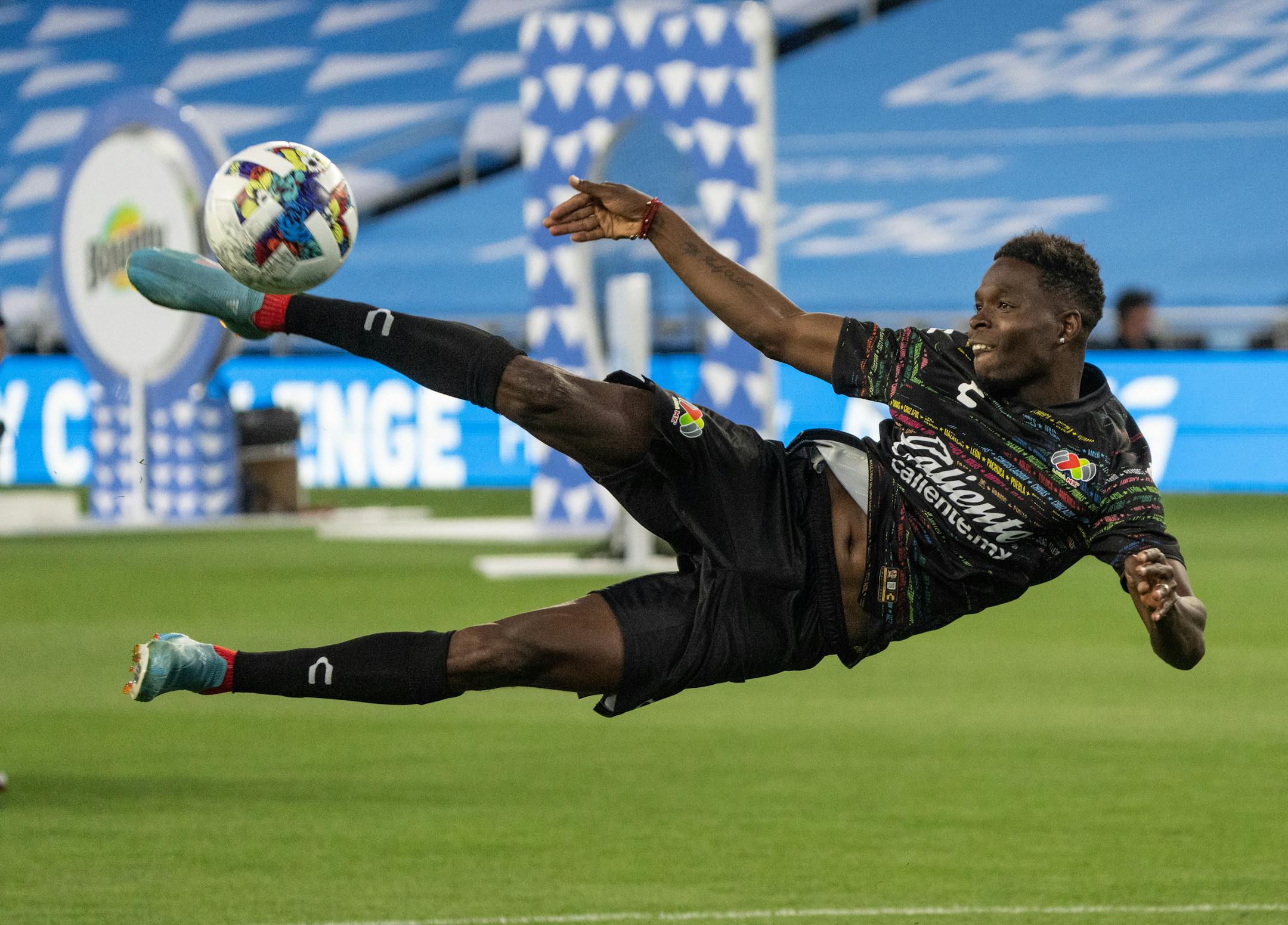 Mexico Liga MX midfielder Avil's Hurtado (11) scores on several bicycle kicks to make Liga MX the Cross and Volley Challenge champions.