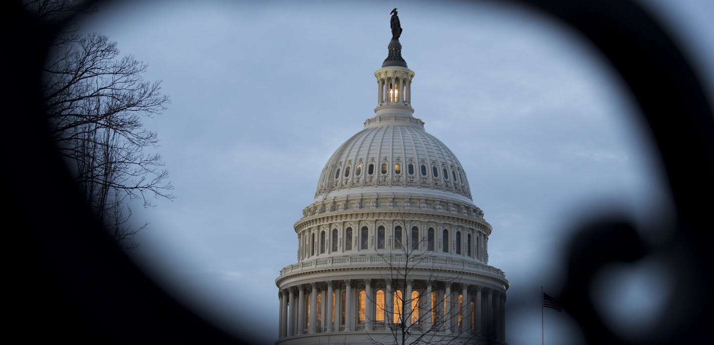 The dome of the U.S. Capitol at sunset in Washington, Jan. 22, 2019. Senate Republicans and Democrats on Tuesday offered the first glimmers of a potential resolution to the five-week partial government shutdown, scheduling procedural votes Thursday on President Donald Trump&#x2019;s proposal to spend $5.7 billion on a border wall and a competing bill that would fund the government through Feb. 8. (Sarah Silbiger/The New York Times)