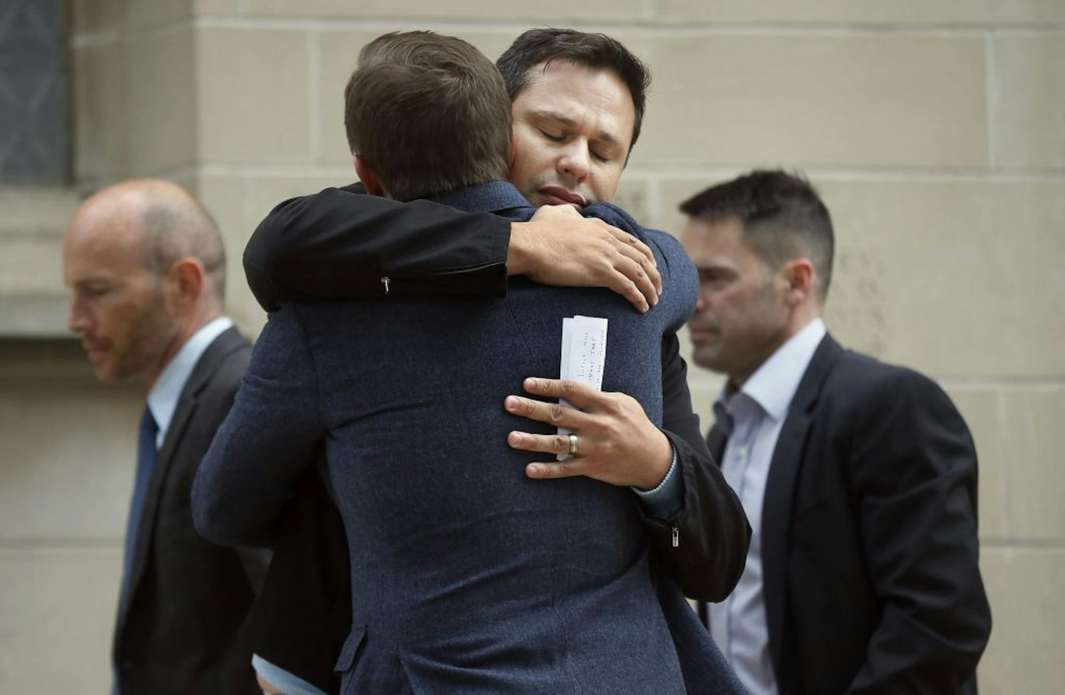 Nathon Bailey hugged a friend after speaking at a press conference about the arrest of Ty Hoffman at St Mark 's Episcopal Cathedral. Hoffman was arrested for killing Nathon's fiance Kelly Phillips September 11 , 2014 in Minneapolis , MN.